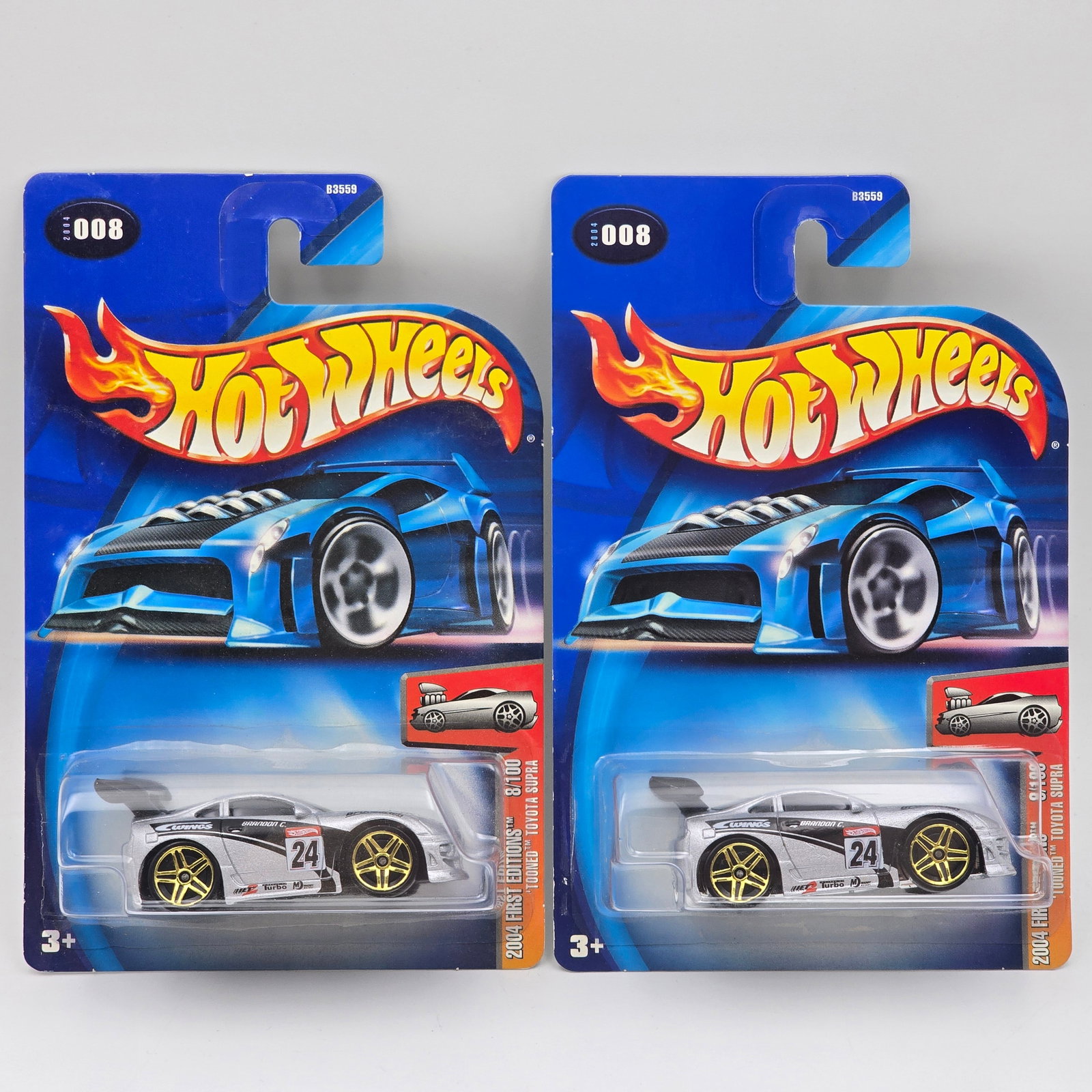 Hot Wheels Tooned Toyota Pair: Hot Wheels 2004 Tooned Toyota Supra Pair Cars are identical except one has a chrome base the other a black base Cars appear to be in good condition with no issues of note Cards are in good shape, may 