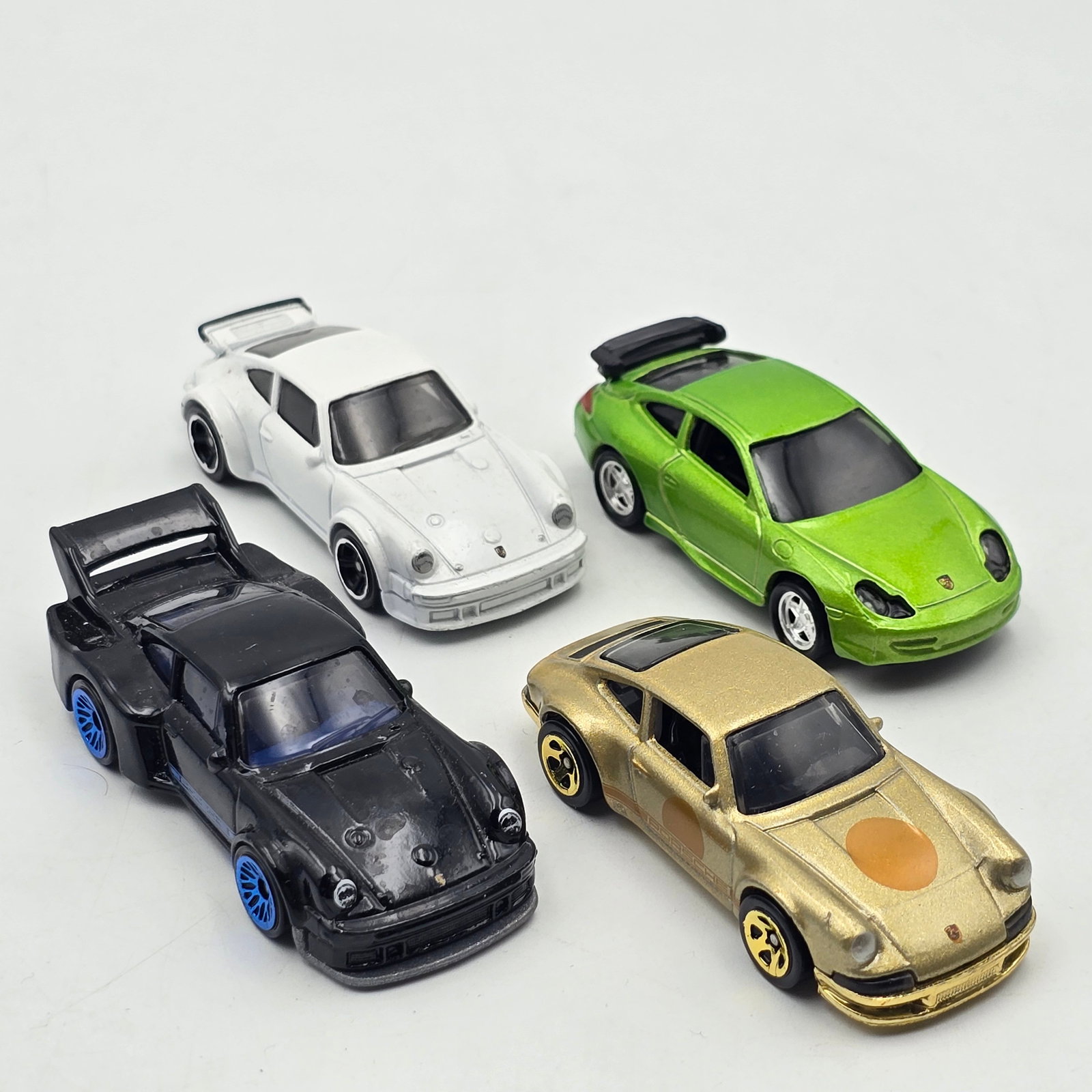Hot Wheels Premium Porsche lot of 4: Hot Wheels mixed series Porsche lot of 4 loose Includes the 4 shown in photos Cars appear to be in good condition with no issues of note Please check photos for complete description