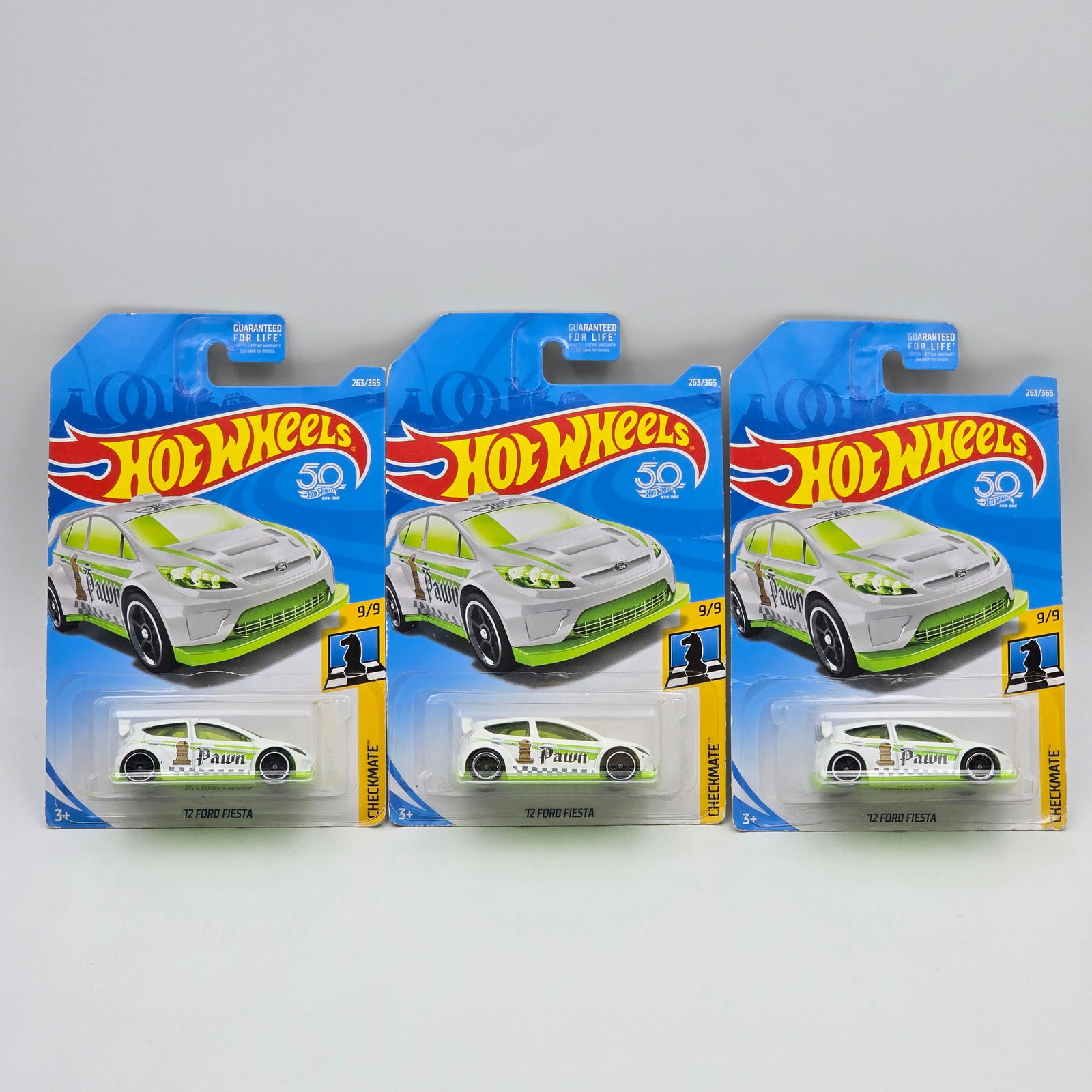 Hot Wheels Ford Fiesta lot of 3: Hot Wheels Checkmate Series 12 Ford Fiesta lot of 3 Three wheel variations 1 with OH5 rear and PR5 front, 1 with PR5 front and rear, 1 with OH5 front and PR5 rear, Cars appear to be in good condition 
