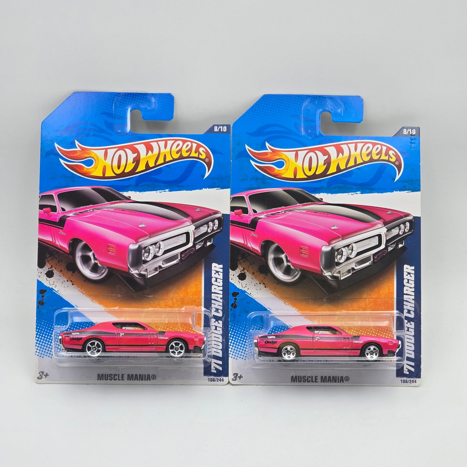 Hot Wheels 71 Dodge Charger Pair: Hot Wheels Pink Muscle Mania 71 Dodge Charger Pair One has 5 spoke wheels, the other has open hole 5 spoke wheels Cars appear to be in good condition with no issues of note Cards are good but may have