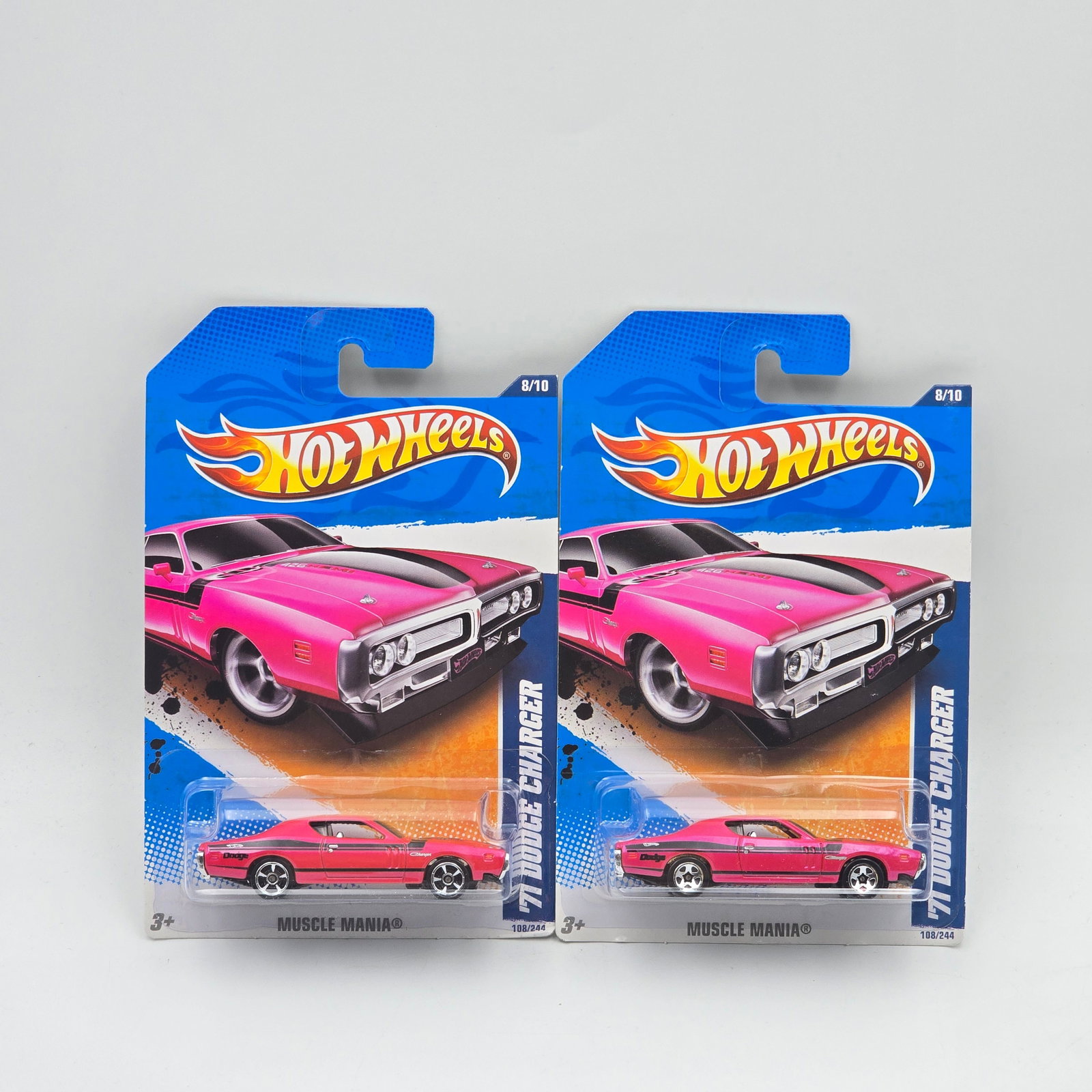 Hot Wheels 71 Dodge Charger Pair: Hot Wheels Pink Muscle Mania 71 Dodge Charger Pair One has 5 spoke wheels, the other has open hole 5 spoke wheels Cars appear to be in good condition with no issues of note Cards are good but may have