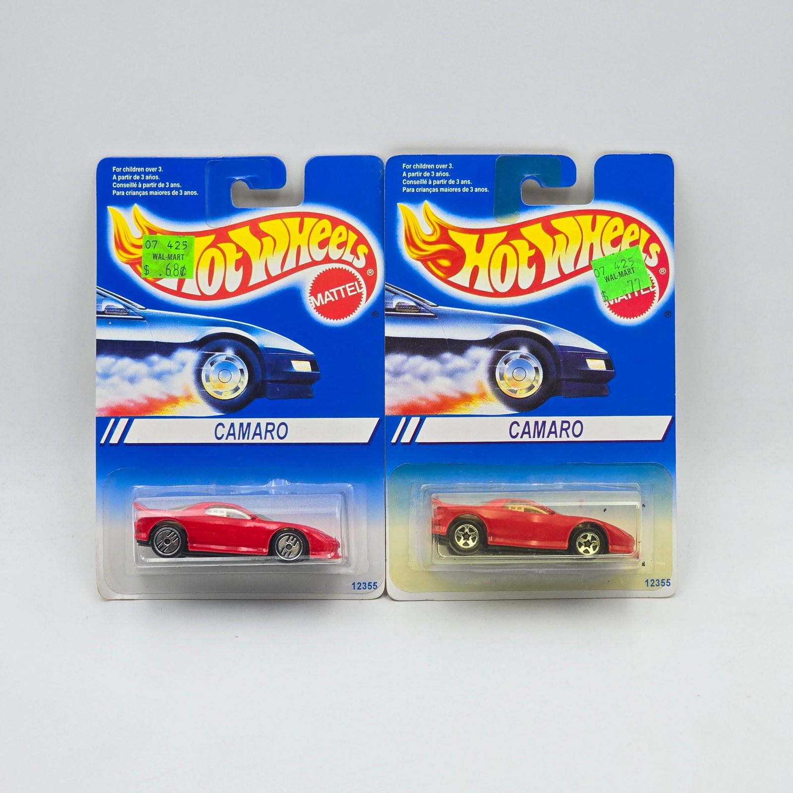 Hot Wheels Camaro pair: Hot Wheels red Camaro pair One has 5 spoke wheels, the other has UH wheels Cars appear to be excellent to near mint with no issues of note Cards are good but may have edge dings, small creases and/or 