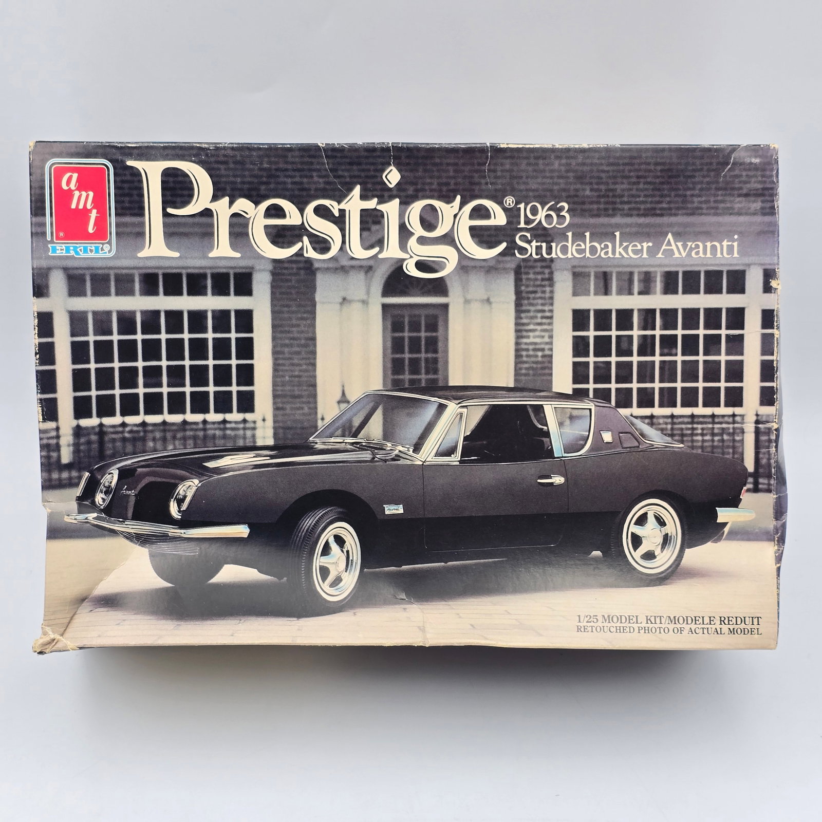 AMT Prestige Model Kit: Lot includes AMT Prestige 1963 Studebaker Avanti (1989) model kit With the box and appears to be unassembled. Box has some storage/shelf wear, including veins/creasing and some damage to the
