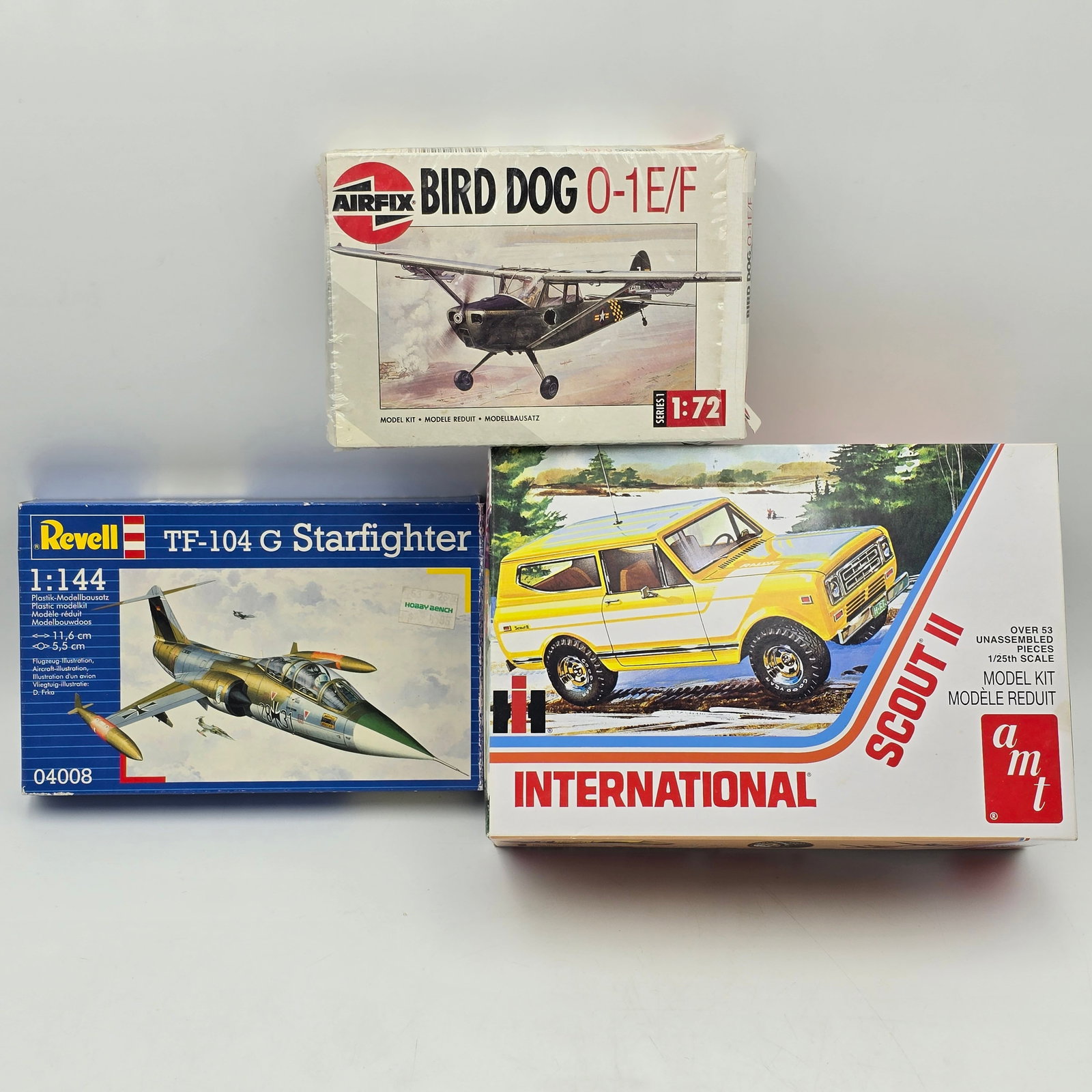 Lot of 3 Model Kits: Lot of 3 Model Kits including: 1- Airfix Bird Dog O-1E/F (1:72 scale) 2- Revell TF-104 G Starfighter (1:144 scale) 3- AMT International Scout (1/2 ton pickup model kit) All items are unassembled