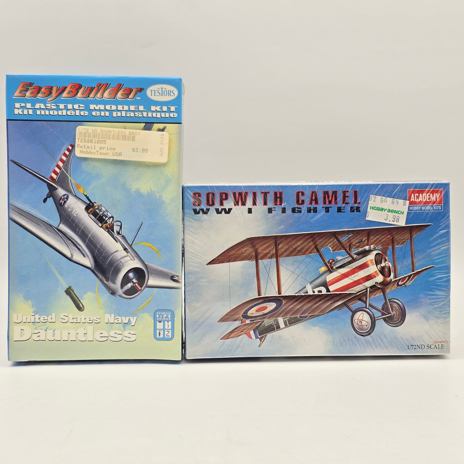 Pair of Plane Model Kits: Pair of Plane Model kits, one Academy and one Testors. Both include the box and look to be complete and unassembled. 1- United States Navy Dauntless (2003) 1- Sopwith Camel WW I Fighter (1984)