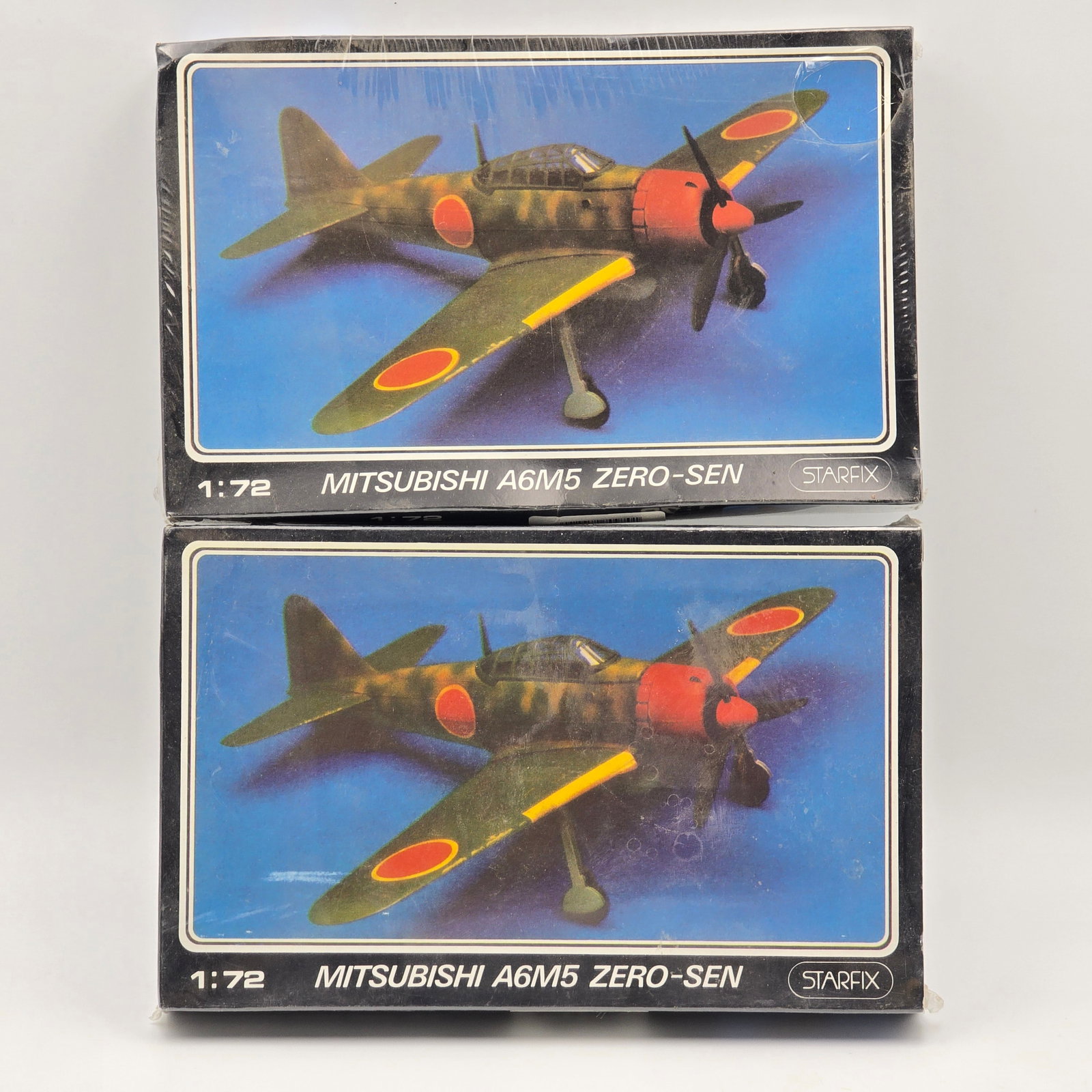 Pair of Starfix Model Kits: Pair of Starfix Model kits, both include the box and look to be complete and unassembled. 2- Mitsubishi A6M5 ZERO-SEN Both boxes look to be in good condition, despite the slight warping of the boxes f