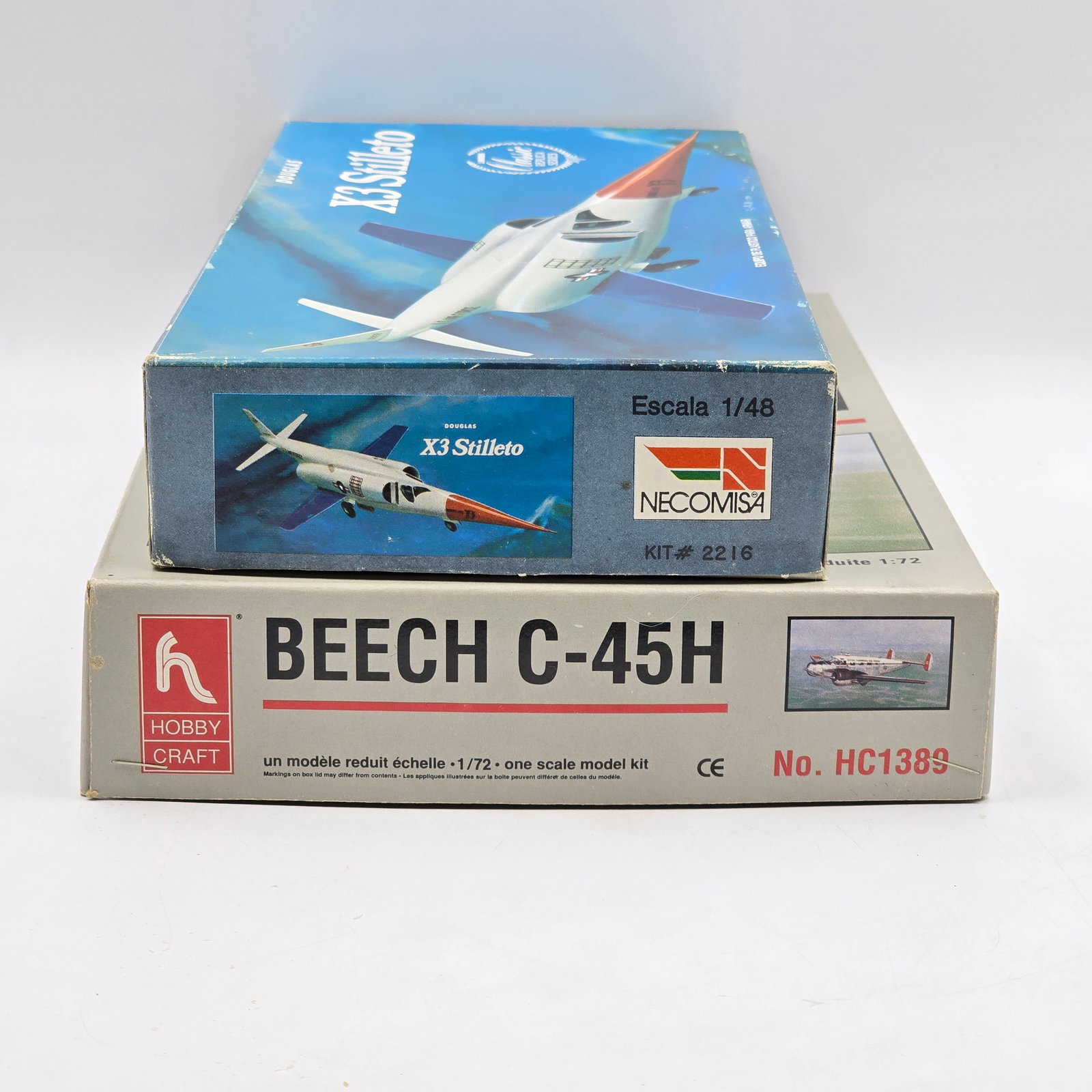 Pair of Plane Model Kits: Pair of Plane Model Kits, one hobby craft and one NECOMS4. Both have box and look to be unassembled. 1- Beech C45H- pieces look to be attached to the trees and complete. 1- X3 Stiletto (1984)-