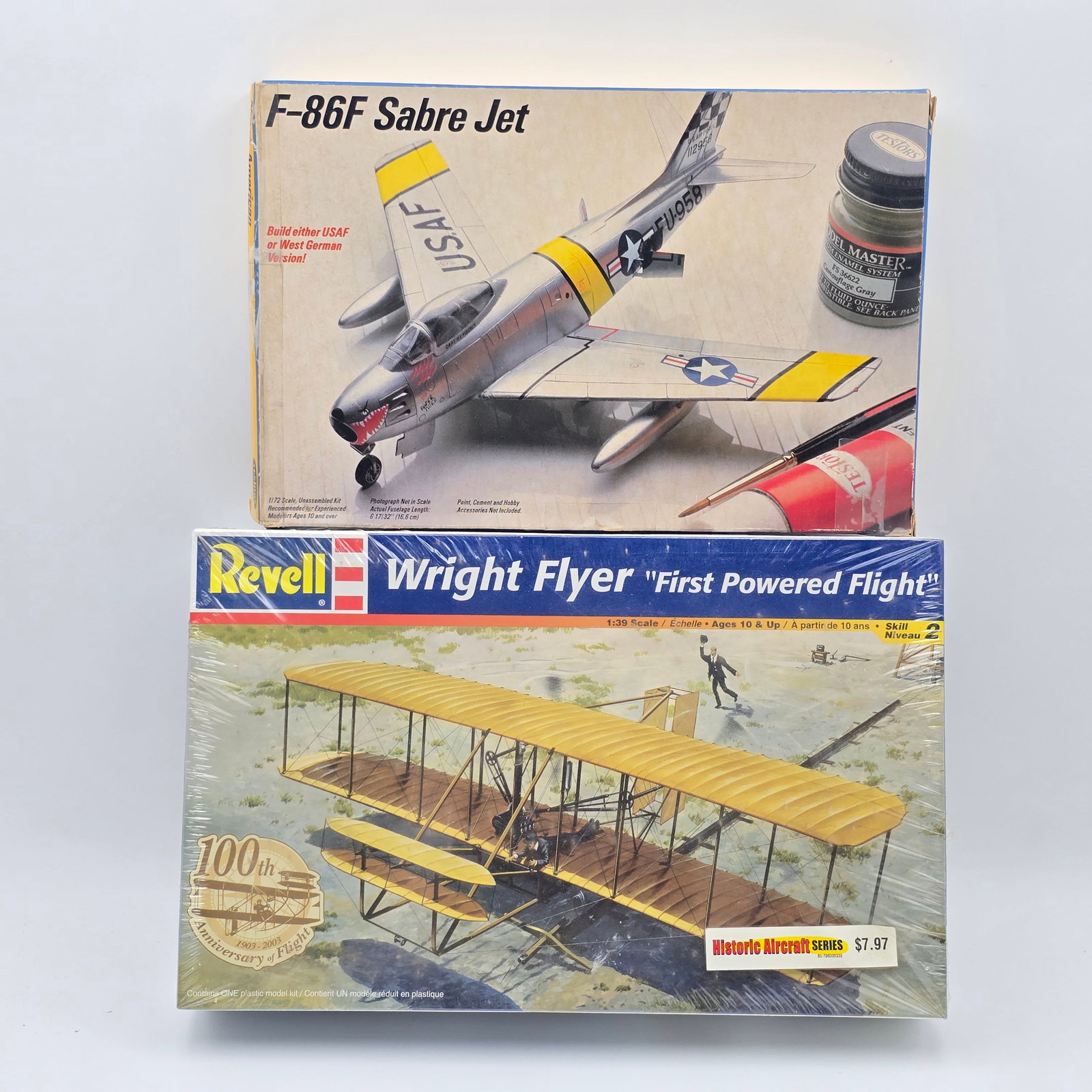Pair of Model Kits: Pair of Plane Model Kits, one Revell and one Testors. Both with box and looks to be complete and unassembled. 1- F-86F Sabre Jet (1985) 1- Wright Flyer (2003) Both include decal sheets and instruction