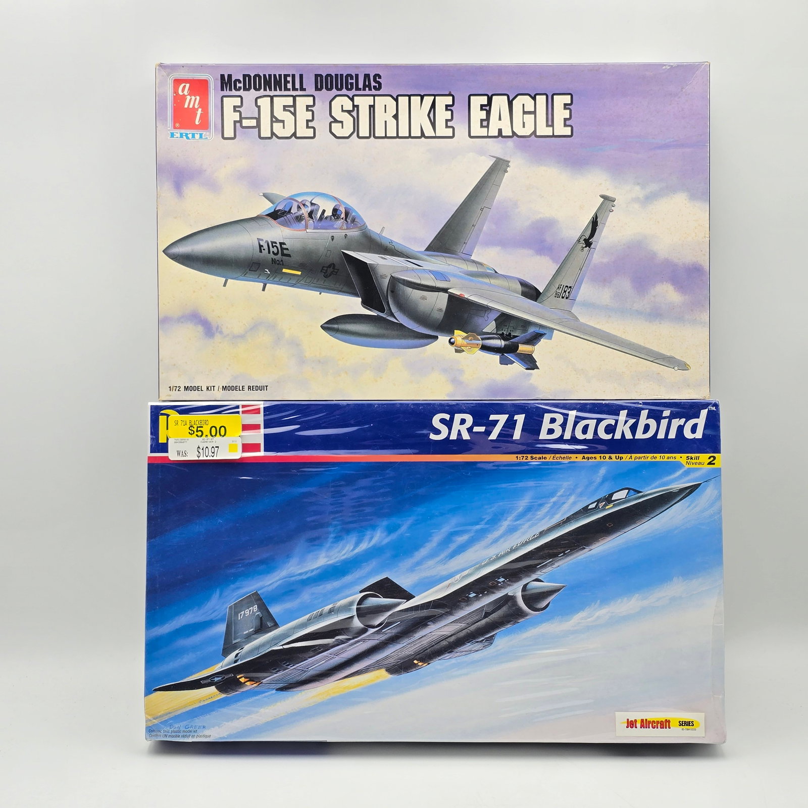 Pair of Jet Model Kits: Pair of Jet Model Kits, one Revell and one AMT. Both with box and look complete and unassembled. 1- F-15E Strike Eagle (1989) - Pieces look to be all attached to the trees. Includes instructions, no