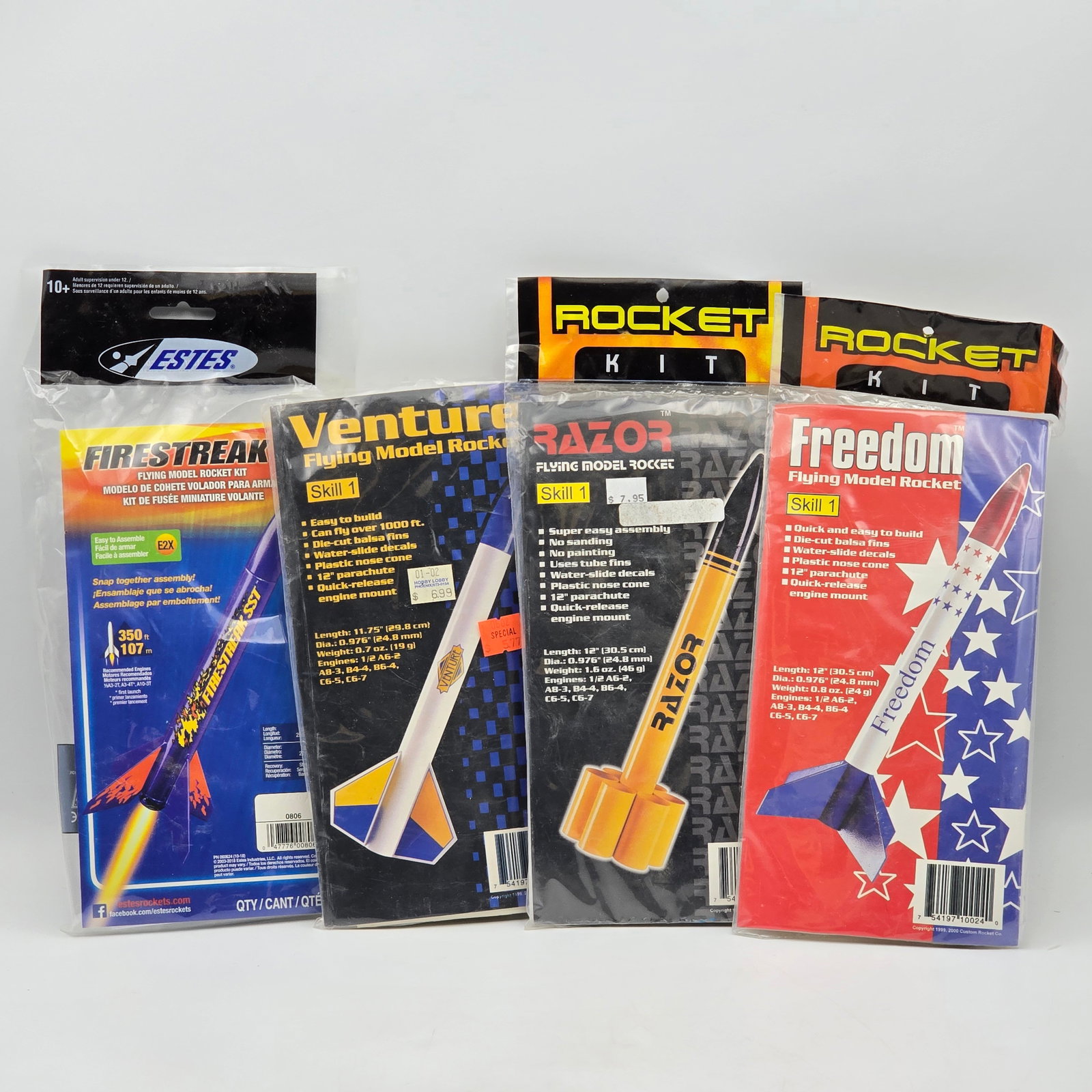 Custom Rocket Co Model Lot of 4: Custom Rocket Company Model Rocket kit lot of 4 Includes - Razor, Venture, Freedom and an Estes Firestreak Kits appear factory sealed and intact except for the Venture, it is open, contents are shown