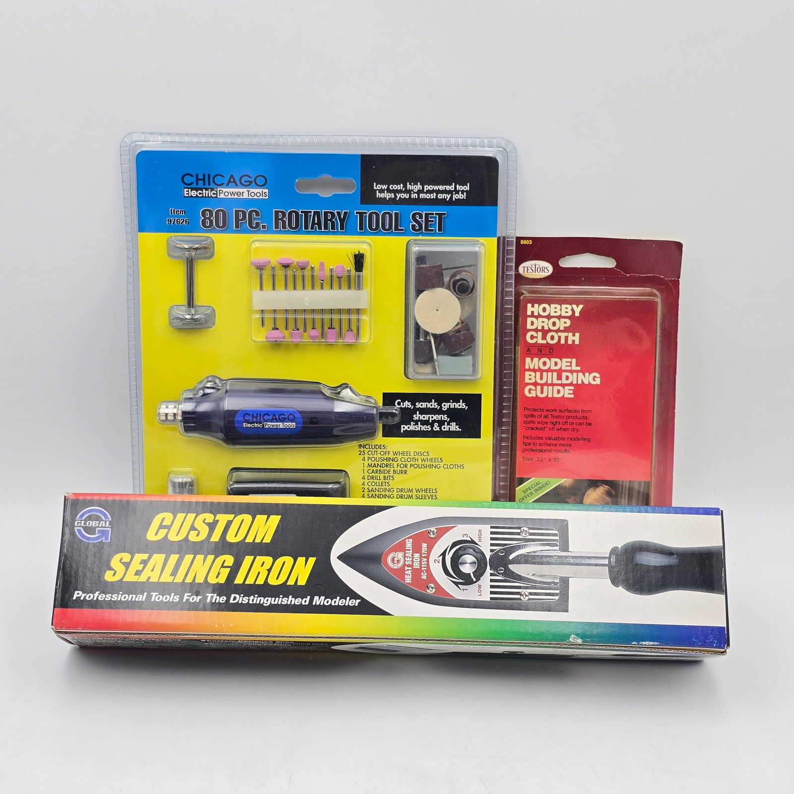 Hobby Model Building Lot: Hobby Model Building lot This includes an 80 Pc Rotary tool, new unused, a custom sealing iron and a Testors Drop cloth still in the package Please check photos for complete description of all that