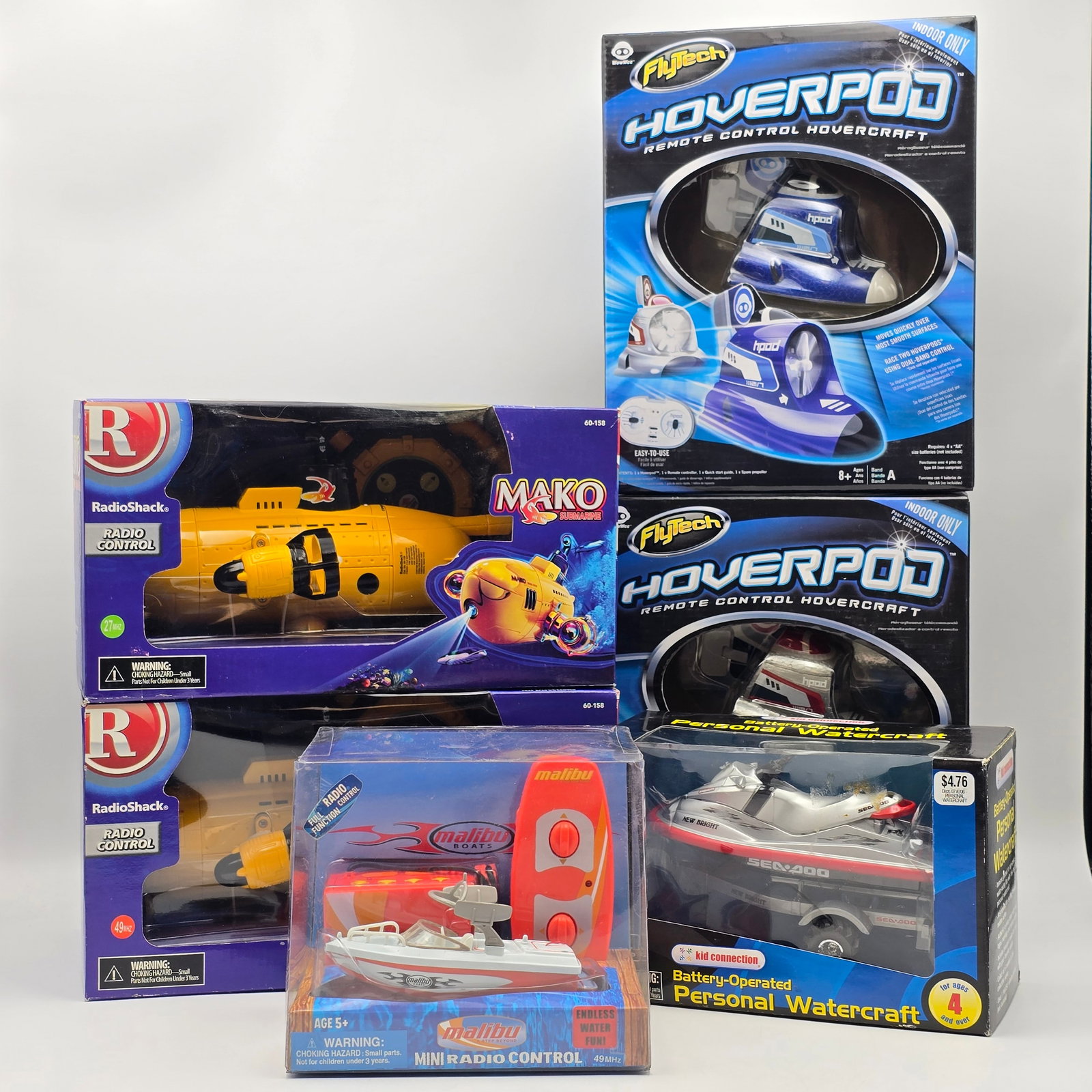 RC Boats & Hovercraft Lot of 6: Lot of 6 remote control vehicles including boats and hovercraft models. Includes multiple FlyTech â€?Hoverpodâ€? RC hovercraft units, RadioShack RC submarine-style vehicles, and