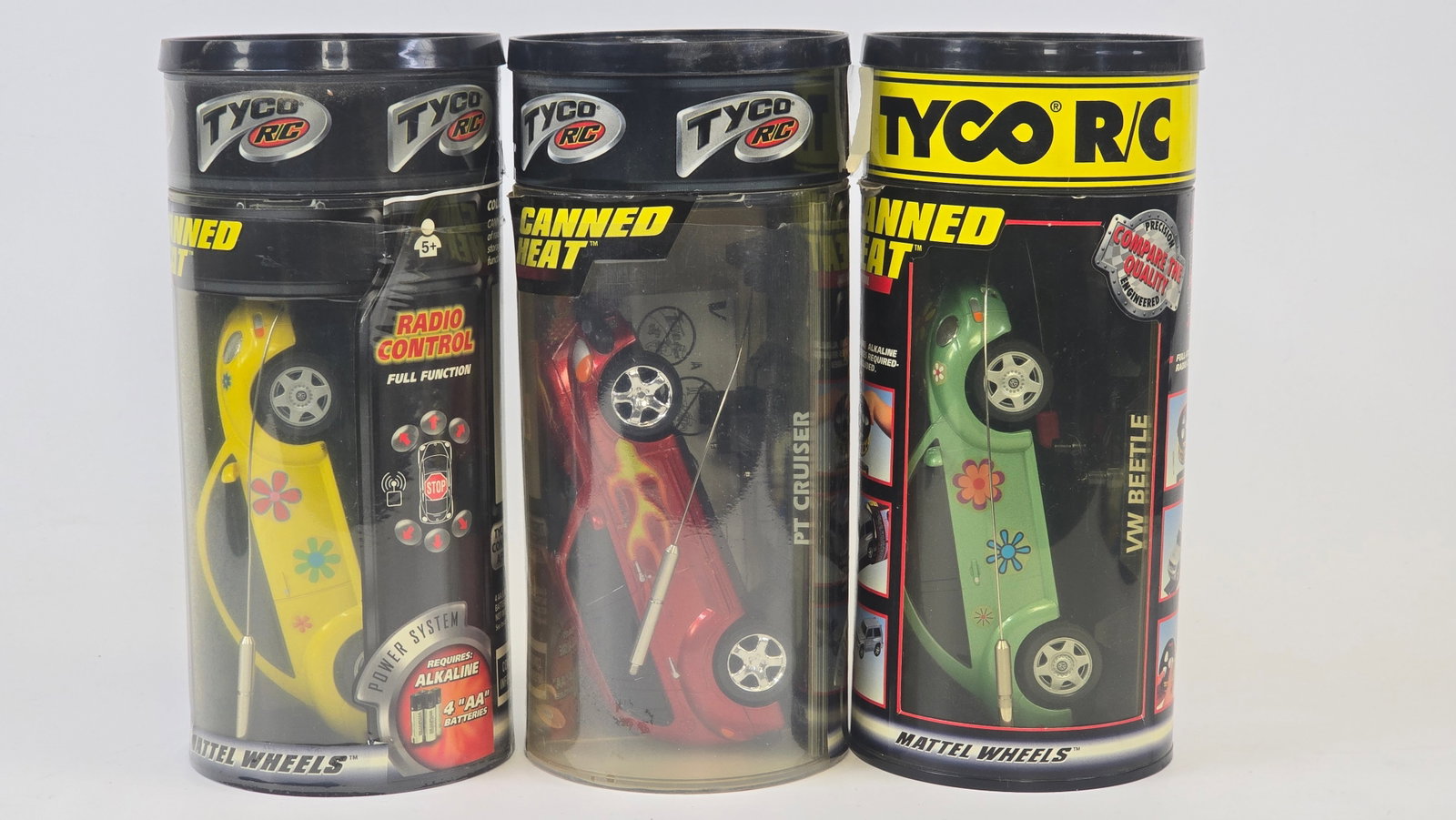 Tyco RC Canned Heat Cars Lot of 3: Lot of 3 Tyco RC â€?Canned Heatâ€? radio control cars in original display canisters. Includes 2 VW Beetles and a PT Cruiser, each with handheld controllers and accessories inside the