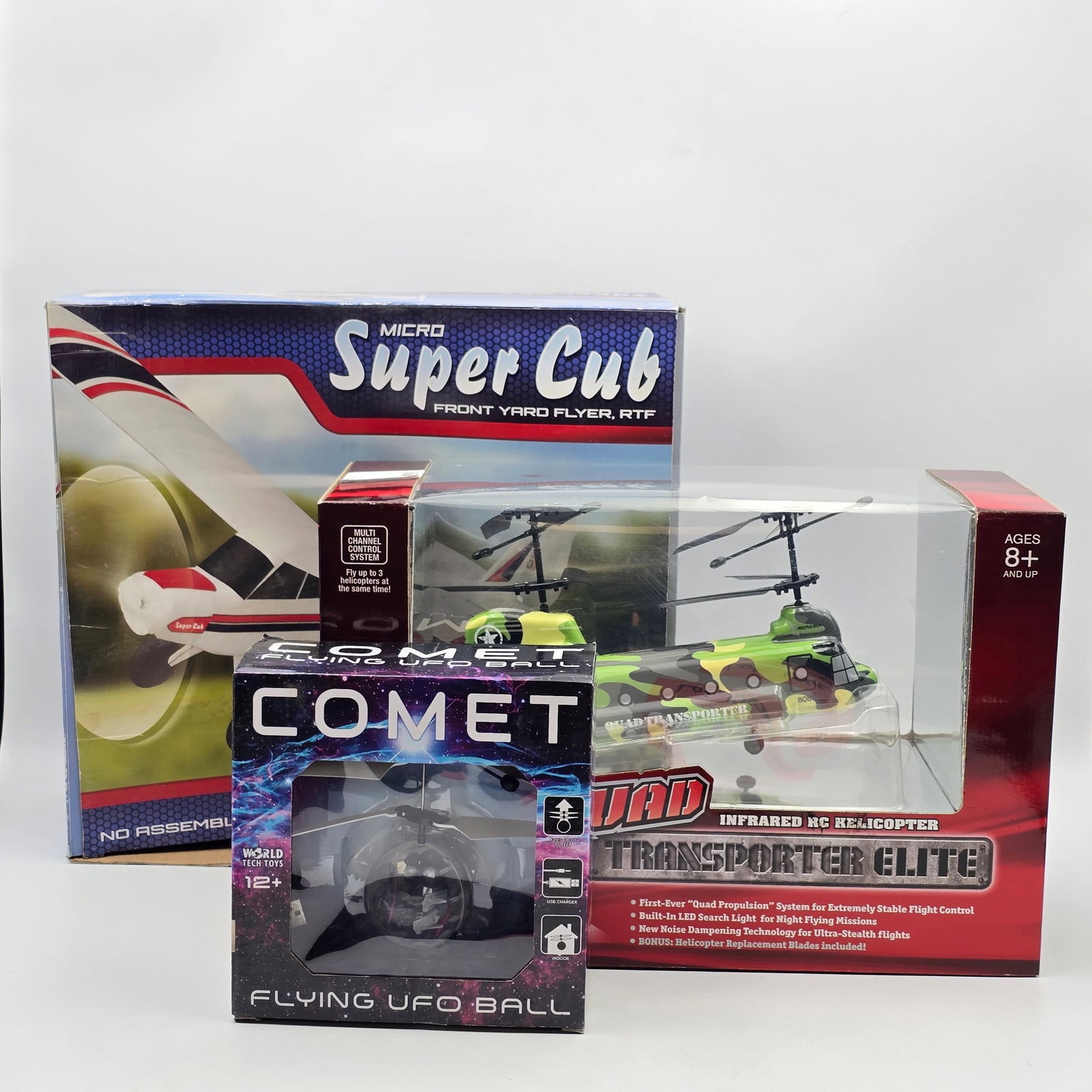 Lot of 3 Assorted RCs: Lot of 3 assorted RC's, including Propel RC, World Tech Toys and more. Boxes look to be in decent condition and for the most part sealed. Micro Super Club, Comet, and Quad Transporter Elite. 