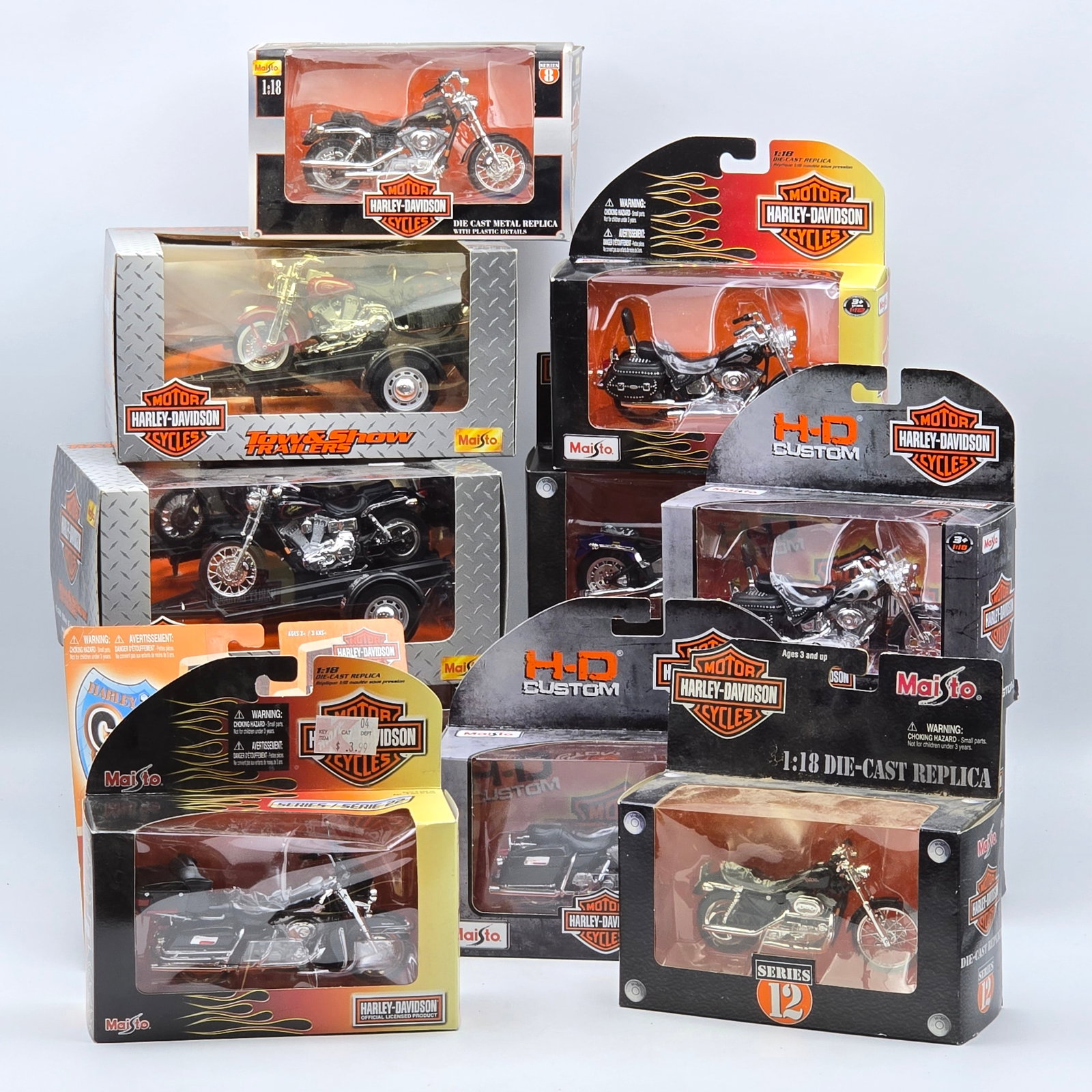 Harley-Davidson Diecast Lot of 12: Lot of 12 Harley-Davidson diecast motorcycle models from Maisto. Includes a mix of cruisers and custom bikes in various styles, with several larger display-scale pieces and detailed finishes. Items ar