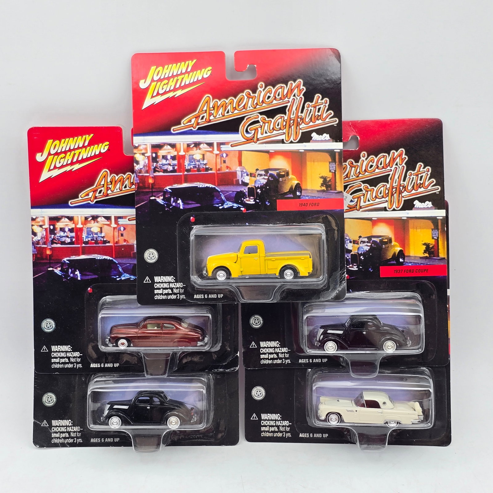 Lot of 5 Johnny Lightning American Graffiti: Lot of 5 Johnny Lightning American Graffiti Diecast Vehicles including: 1- 1932 Ford Coupe 2- 1949 Custom Mercury 3- 1937 Ford Sedan 4- 1956 Ford F-100 5- 1940 Ford Pickup