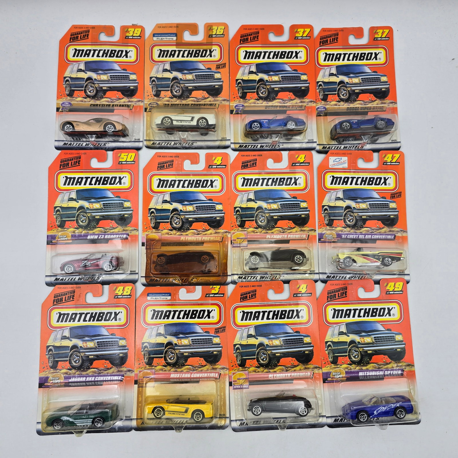 Matchbox Diecast Lot of 12 Cars: Lot of 12 Matchbox diecast vehicles, all carded. Includes a mix of sports cars, concept vehicles, and everyday cars with a good range of styles and colors. All items are unopened in original blister p