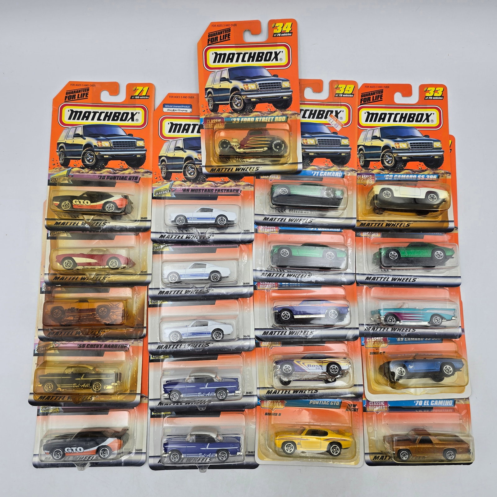 Matchbox Diecast Lot of 20 Cars: Lot of 20 Matchbox diecast vehicles, all carded. Includes a mix of cars, muscle cars, and classic-style castings with a variety of colors and designs. Some duplication present within the lot. All item