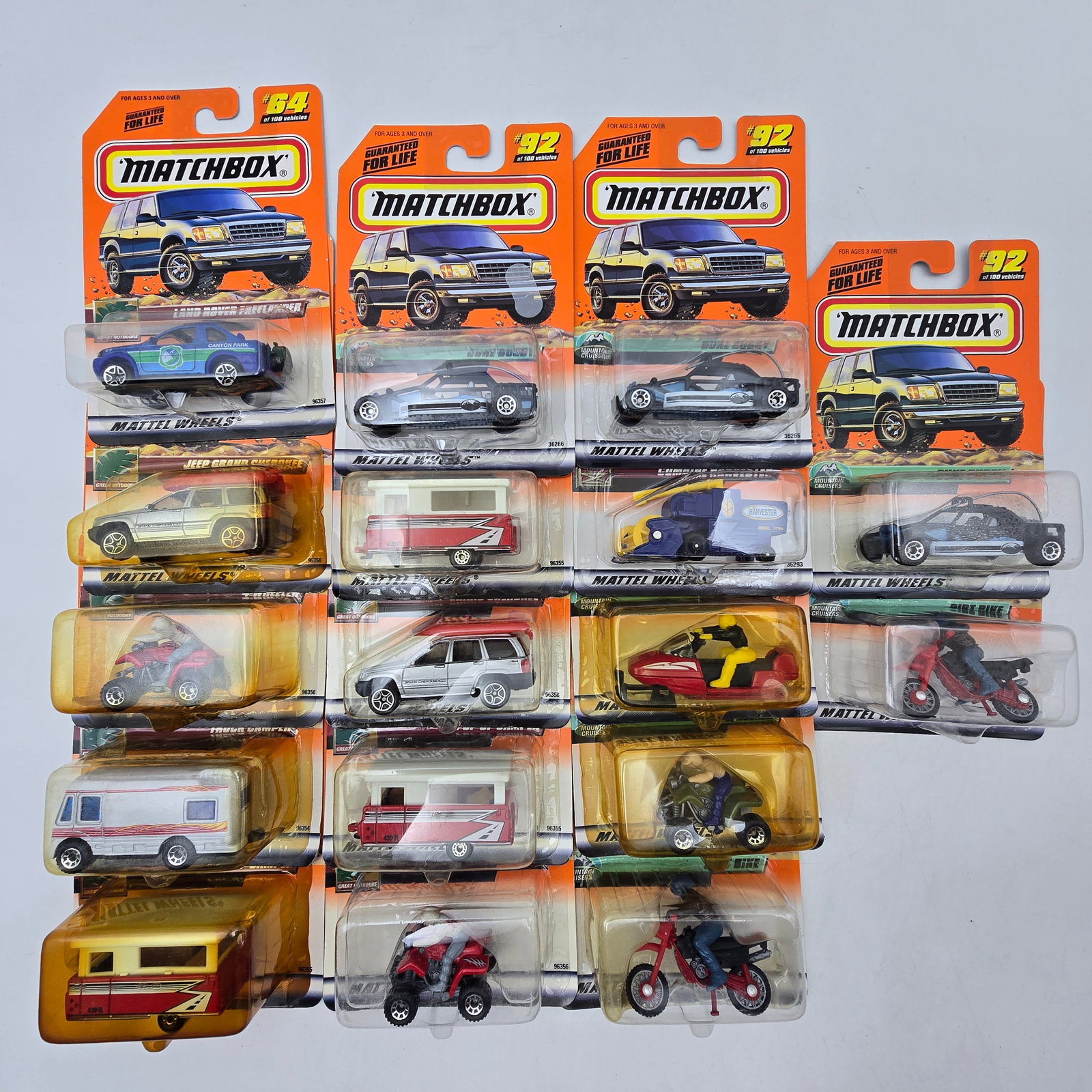 Matchbox Diecast Lot of 17 Cars & Bikes: Lot of 17 Matchbox diecast vehicles, all carded. A mixed group with a little bit of everythingâ€”cars, vans, emergency vehicles, plus a few motorcycles and specialty pieces mixed in. All i