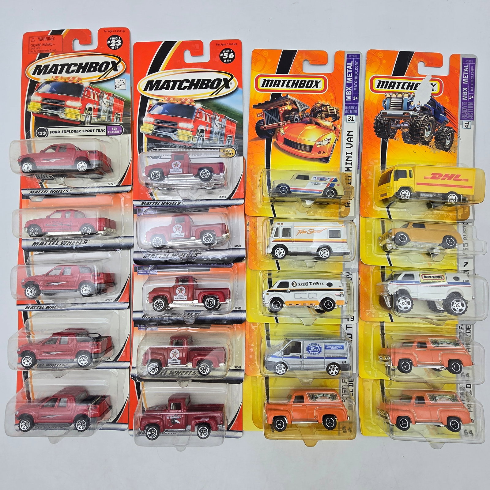 Matchbox Diecast Lot of 20 Cars & Trucks: Lot of 20 Matchbox diecast vehicles, all carded. This lot includes a number of repeatsâ€”mainly red cars and trucksâ€”along with a mix of vans, SUVs, and a few utility vehicles