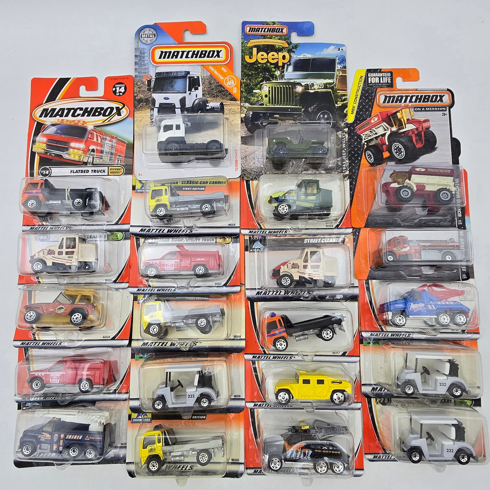 Matchbox Diecast Lot of 22 Trucks & Vans: Lot of 22 Matchbox diecast vehicles, all carded. Working-vehicle mix with plenty of trucks, vans, and service rigsâ€”tow trucks, utility vehicles, and a few off-road pieces mixed in. All i