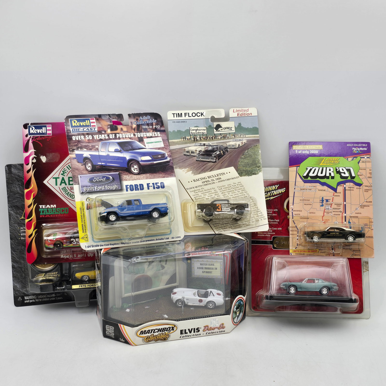Mixed Lot of 7 Diecast Vehicles: Lot of 7 Diecast Vehicles including: 1- Revell Ford F-150 (1:64 scale) 2- Revell Racing â€?Tabascoâ€? NASCAR stock car 3- Tim Flock Stock Car (Limited Edition) 4- Johnny Lightning