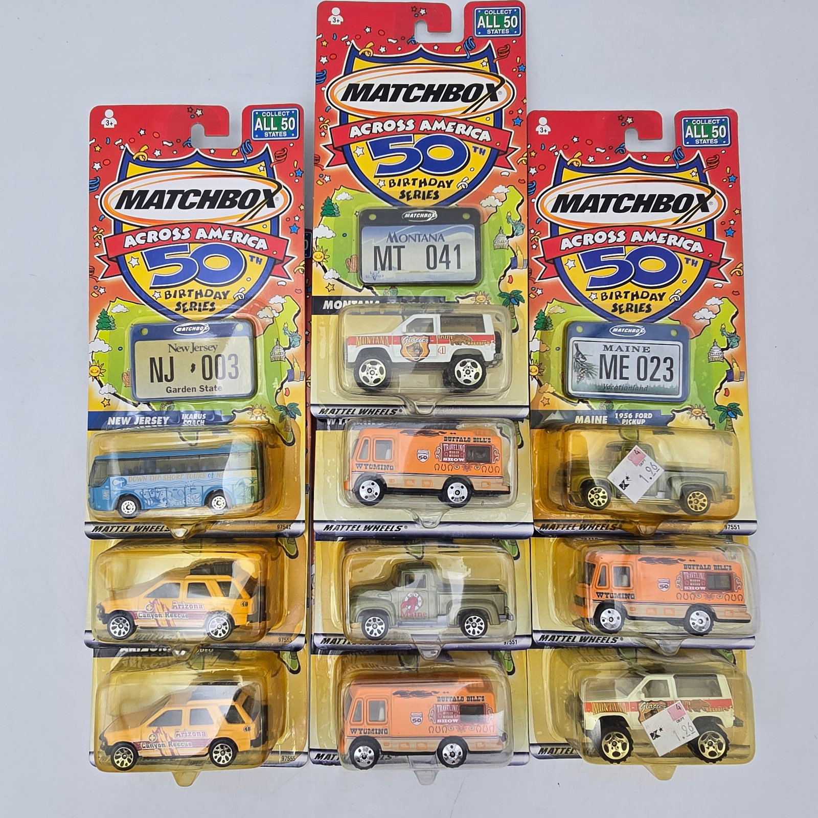 Matchbox Across America Lot of 10: Lot of 10 Matchbox Across America 50th Birthday Series Vehicles. Includes multiple state-themed vehicles such as Arizona, New Jersey, Montana, Wyoming, Maine, and others. All items are in original pac