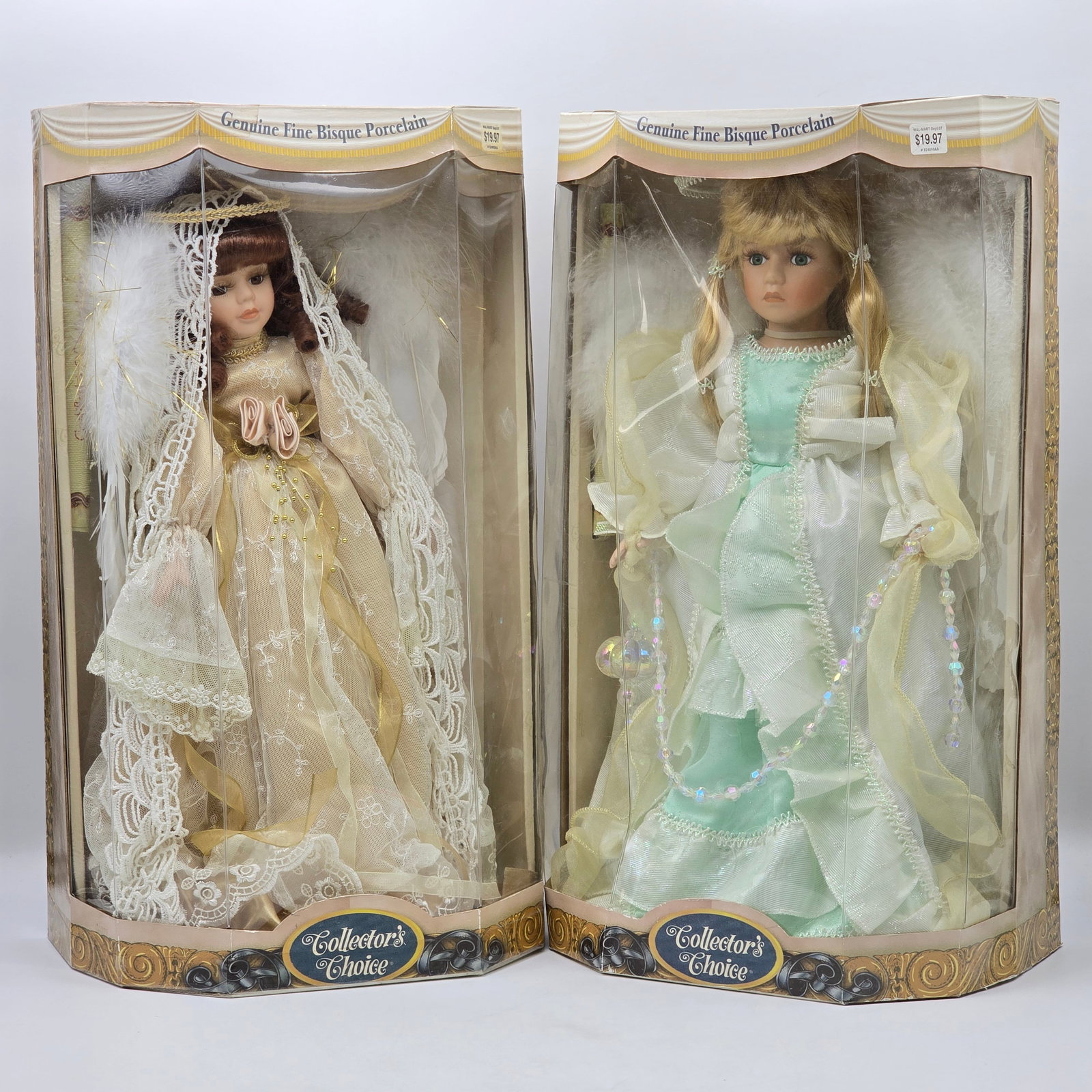 Pair of Porcelain Dolls: Lot of 2 Collectible Porcelain Dolls including: 1- Collectorâ€™s Choice Porcelain Doll in Gold Dress with Lace Veil and Feather Detail 2- Collectorâ€™s Choice Porcelain Doll in Mint Gr