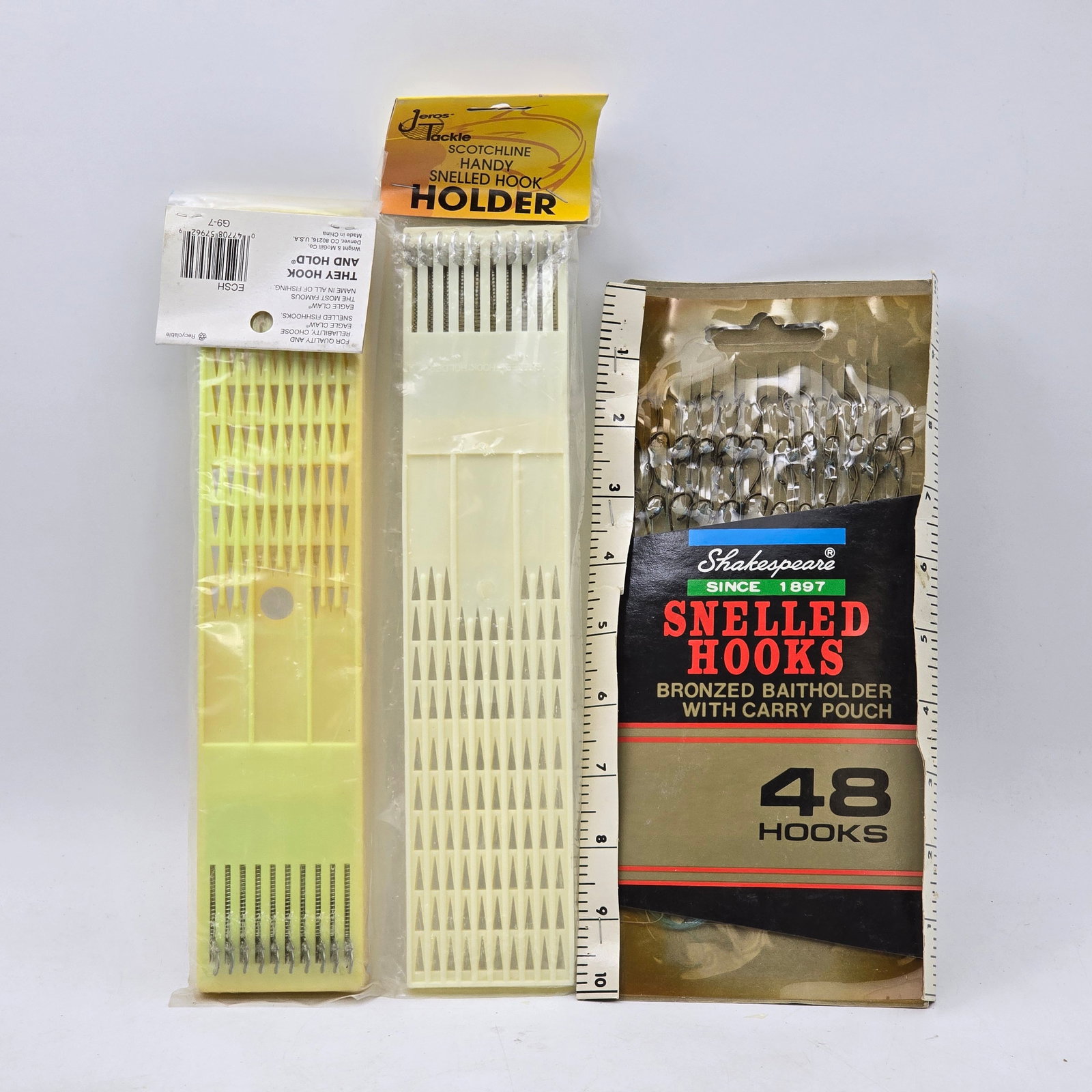 Snelled Hooks Holder Set Lot 3pc: Lot of 3 Fishing Hook Items including: 1- Snelled Hook Holder with Pre-Tied Hooks 2- Snelled Hook Holder with Pre-Tied Hooks 3- Shakespeare Snelled Hooks with Carry Pouch (48 Hooks) Items appear new
