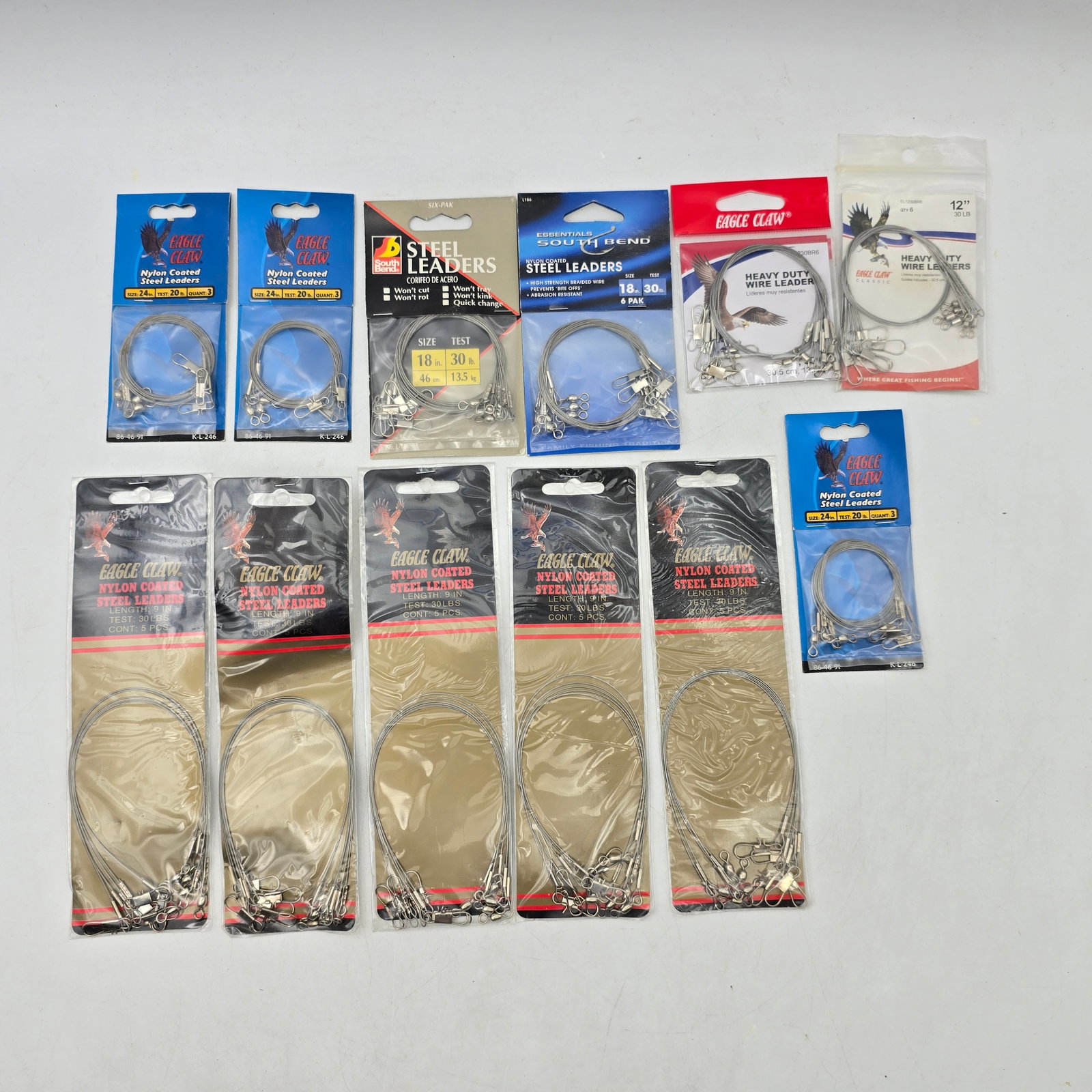 Fishing Leaders Lot 12pc Steel: Lot of 12 Packs of Fishing Leaders including: - Steel Fishing Leaders Packs (multiple brands & various sizes/lengths) Items appear new in original packaging with some shelf wear from