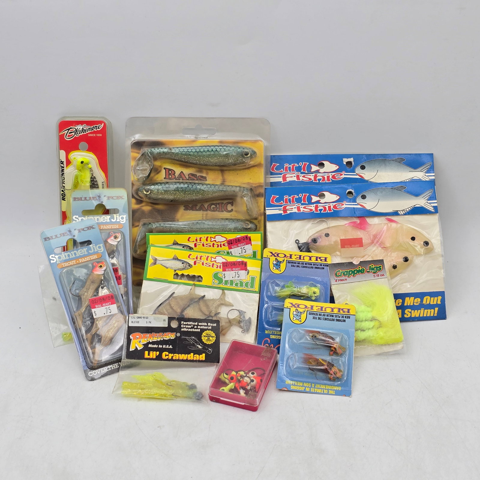 Fishing Lures Lot 14pc Mixed: Lot of 14 Packs of Fishing Lures including: 1- Shad Style Swim Baits Packs (multiple brands) 2- Assorted Jigs & Spinner Lures Packs 3- Soft Plastic Baits & Crawdad Lures Packs Items appear