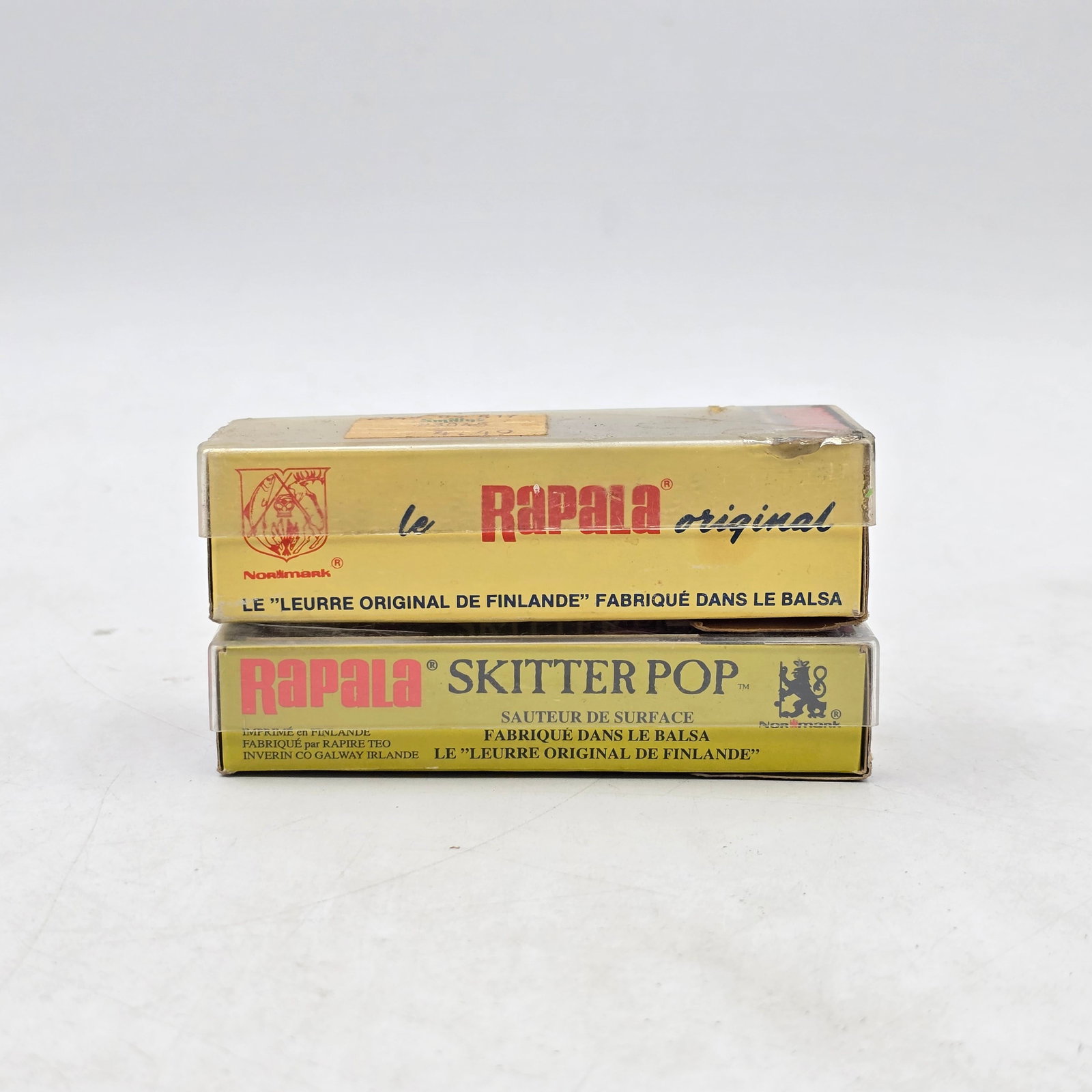 Rapala Fishing Lures Lot: Lot of Rapala Fishing Lures. Includes Rapala Original and Skitter Pop lures, with original boxes included. Lures show light to moderate wear from use and storageâ€”please review photos
