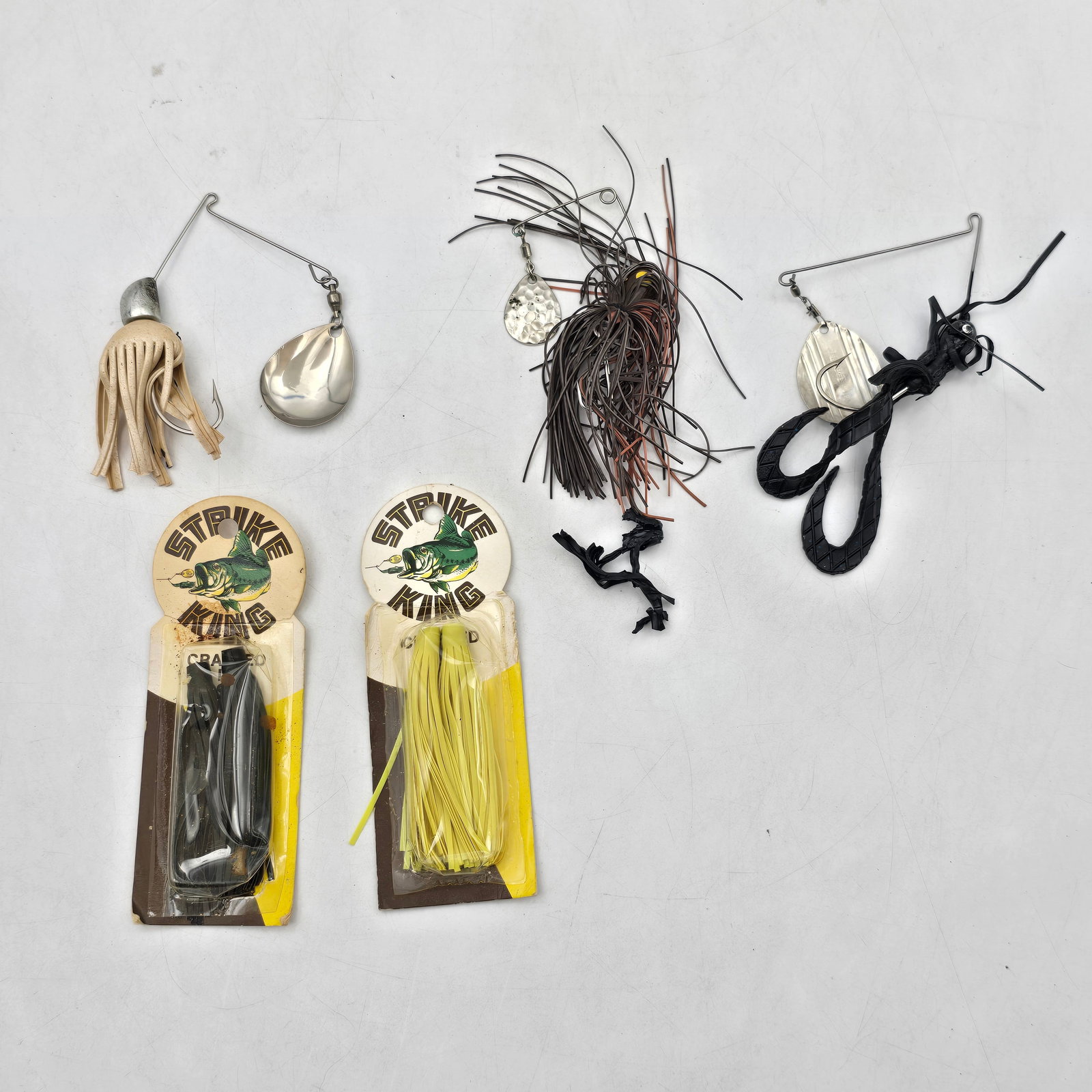 Spinnerbait Fishing Lures 5pc: Lot of 5 Spinnerbait Fishing Lures. Includes a mix of spinnerbait-style lures in various colors and configurations, including Strike King packaged examples and loose pieces. Designed for flash and