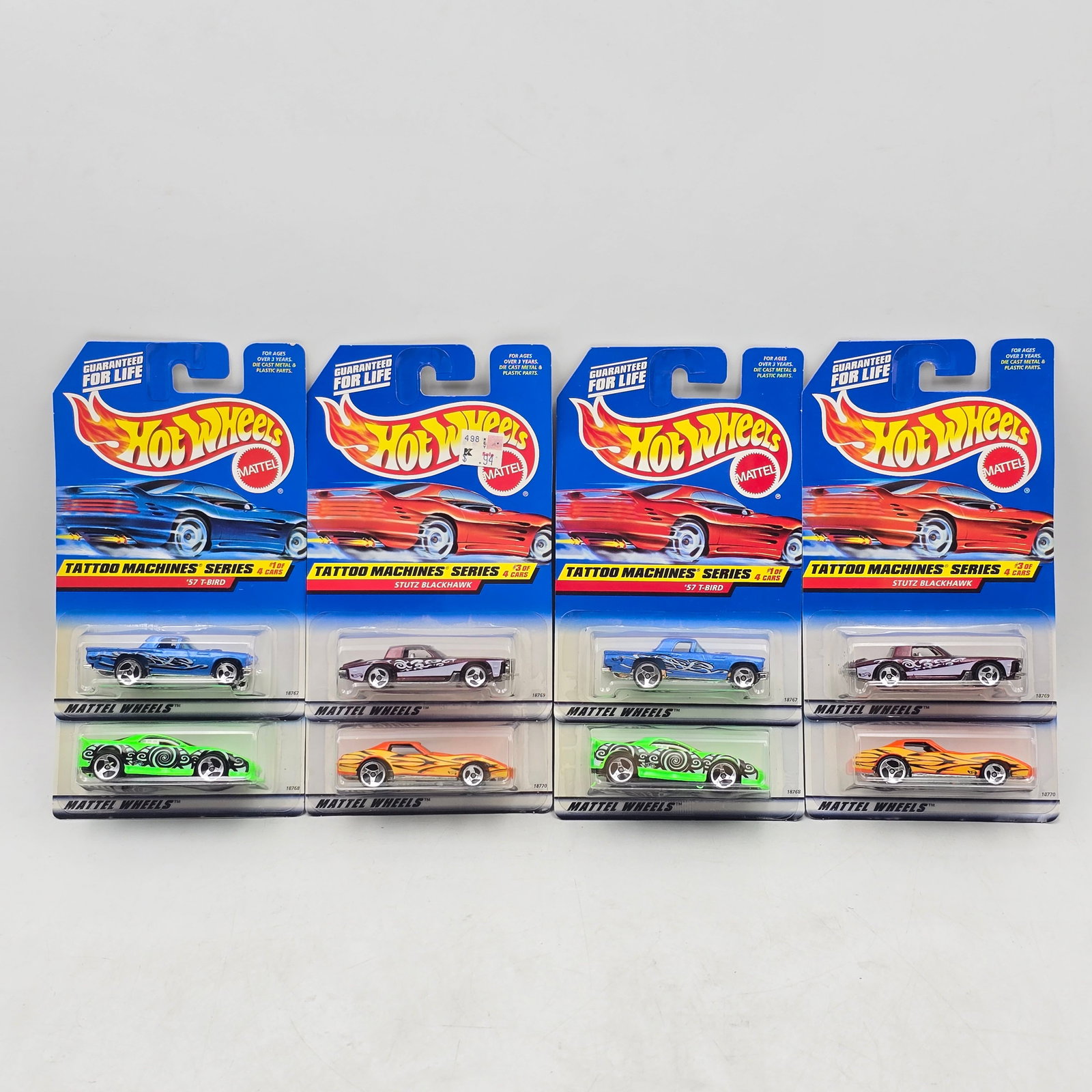 Pair of Hot Wheels Sets: Lot of 8 Hot Wheels Diecast Vehicles from the Tattoo Machines Series including two complete sets: 1- â€?57 T-Bird (Collector #685) 2- â€?93 Camaro (Collector #686) 3- Stutz Blackhawk (Coll