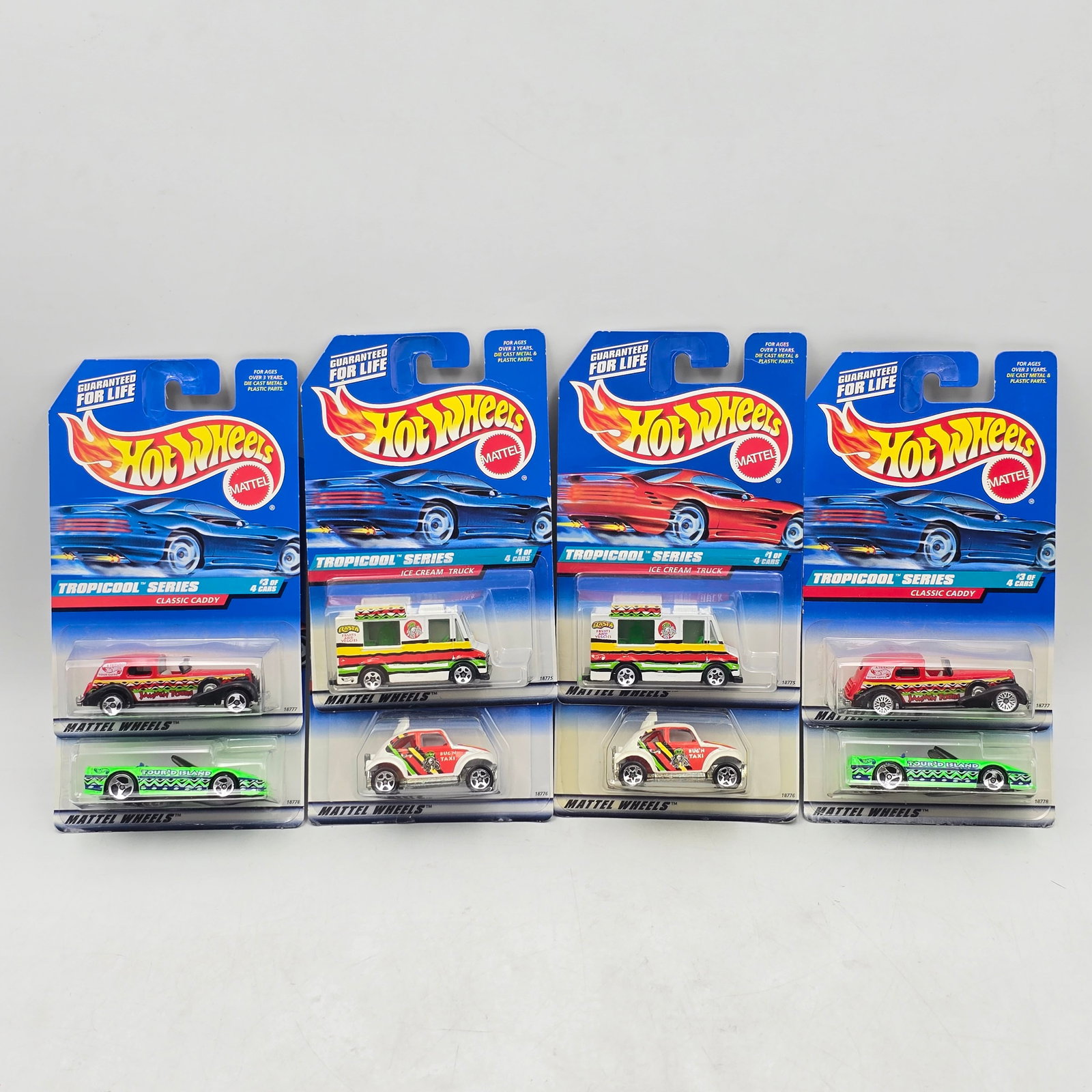 Pair of 90s Hot Wheels Sets: Lot of 8 Hot Wheels Diecast Vehicles from the Tropicool Series including: 1- Ice Cream Truck 2- Baja Bug 3- Classic Caddy 4- Corvette Convertible Includes 2 complete sets.