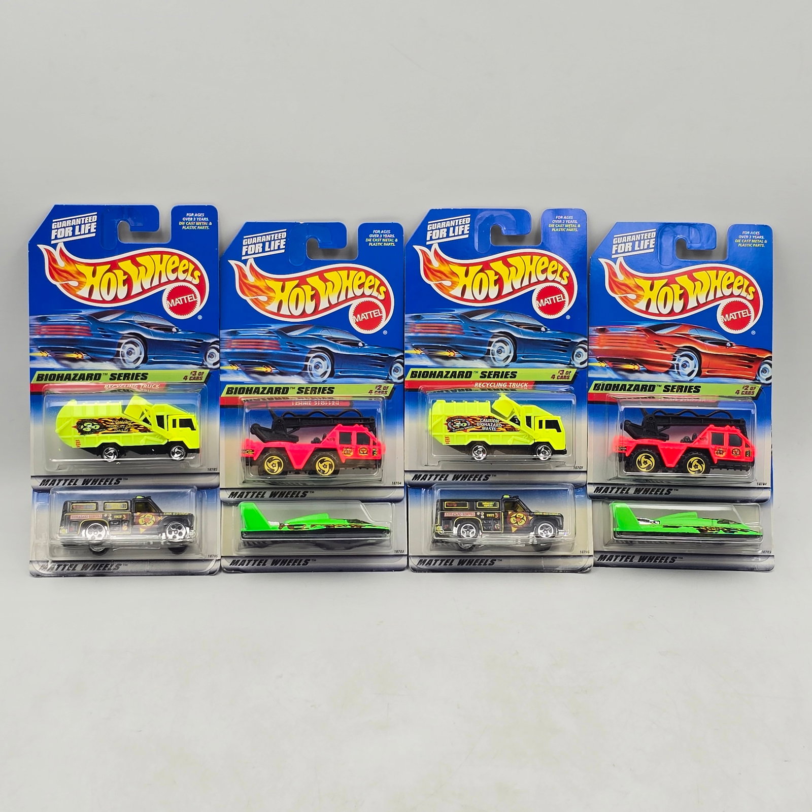 Hot Wheels Biohazard Series Lot of 8: Lot of 8 Hot Wheels diecast cars from the Biohazard Series (2 complete sets). Includes Hydroplane (#717), Flame Stopper (#718), Recycling Truck (#719), and Rescue Ranger (#720), all with bold hazard-t