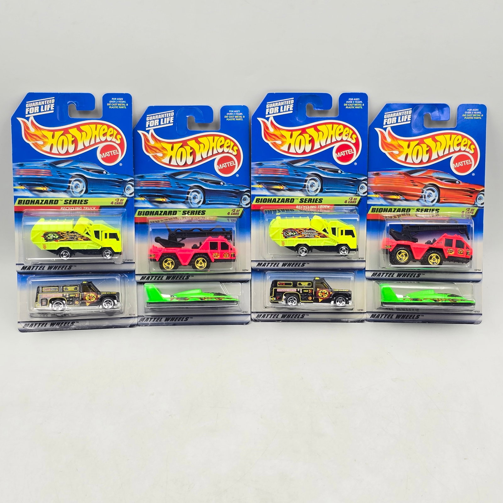 Hot Wheels Biohazard Lot of 8: Lot of 8 Hot Wheels diecast cars from the Biohazard Series (2 complete sets). Includes Hydroplane (#717), Flame Stopper (#718), Recycling Truck (#719), and Rescue Ranger (#720), all done in bright haz