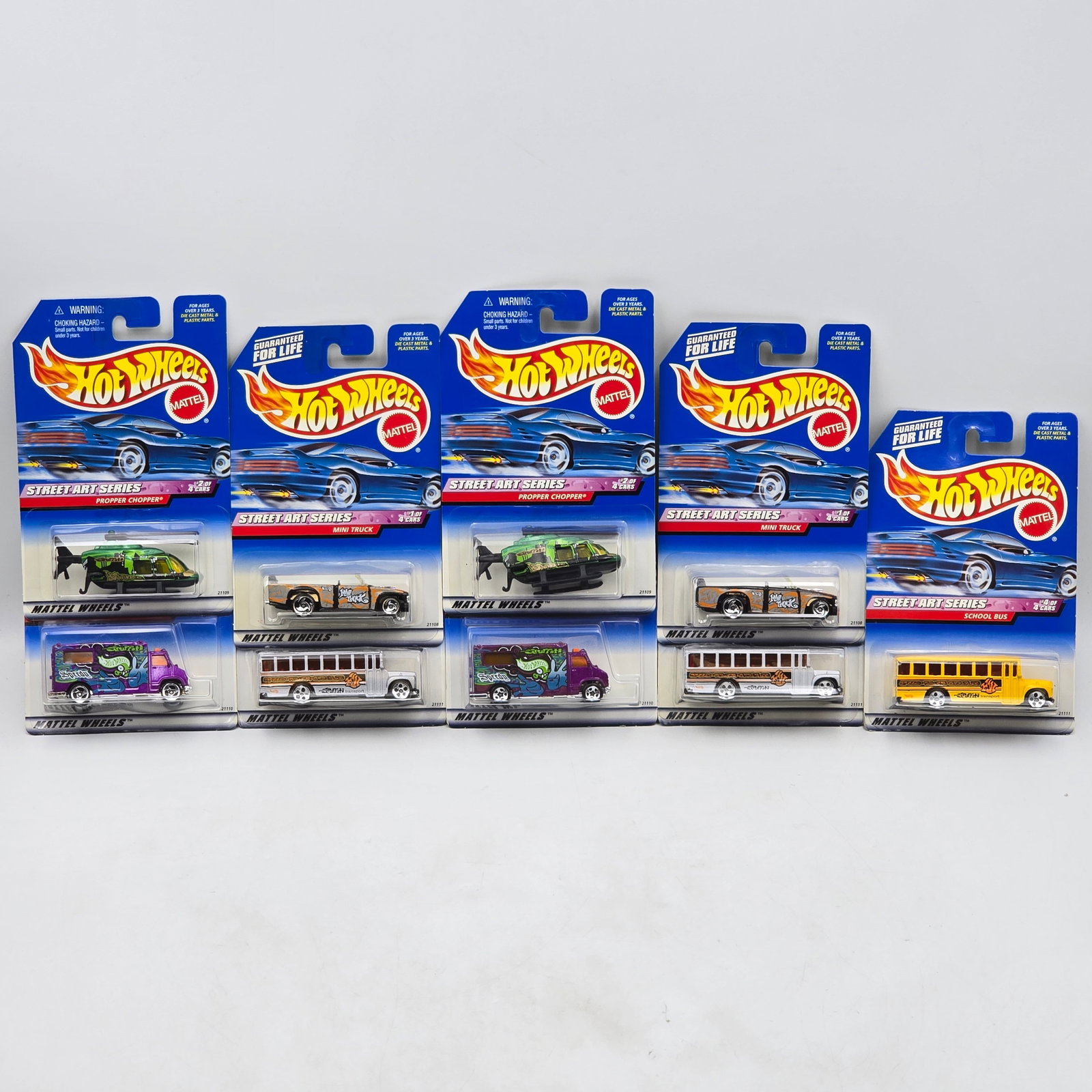 Hot Wheels Street Art Lot of 9: Lot of 9 Hot Wheels diecast cars from the Street Art Series, including 2 complete sets plus one bus variation. Includes Mini Truck (#949), Propper Chopper (#950), Ambulance (#951), and School Bus (#95