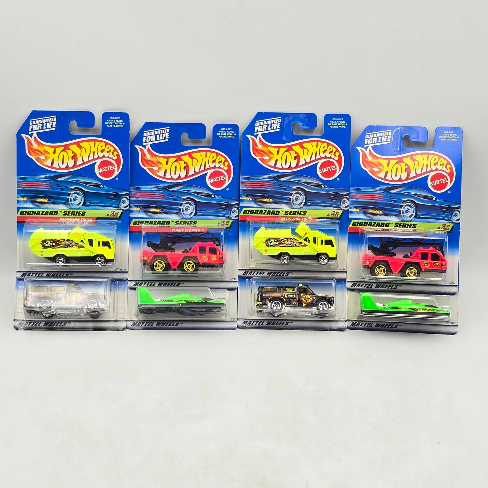 Hot Wheels Biohazard Series Lot of 8: Lot of 8 Hot Wheels diecast cars from the Biohazard Series (2 complete sets). Includes Hydroplane (#717), Flame Stopper (#718), Recycling Truck (#719), and Rescue Ranger (#720), all done in bright haz