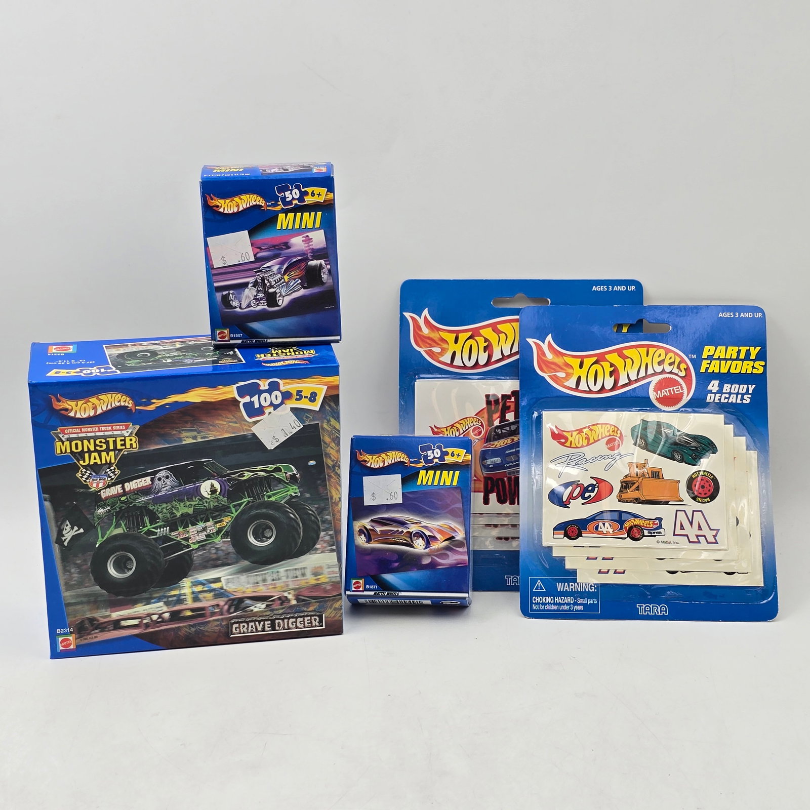 Hot Wheels Puzzle Lot: Lot of 5 Hot Wheels Items including: 1- Monster Jam Grave Digger Puzzle (100 piece) 2- Hot Wheels Party Favors Decal Set (multiple) 3- Hot Wheels Mini Vehicle Puzzles (50 piece) (multiple) 