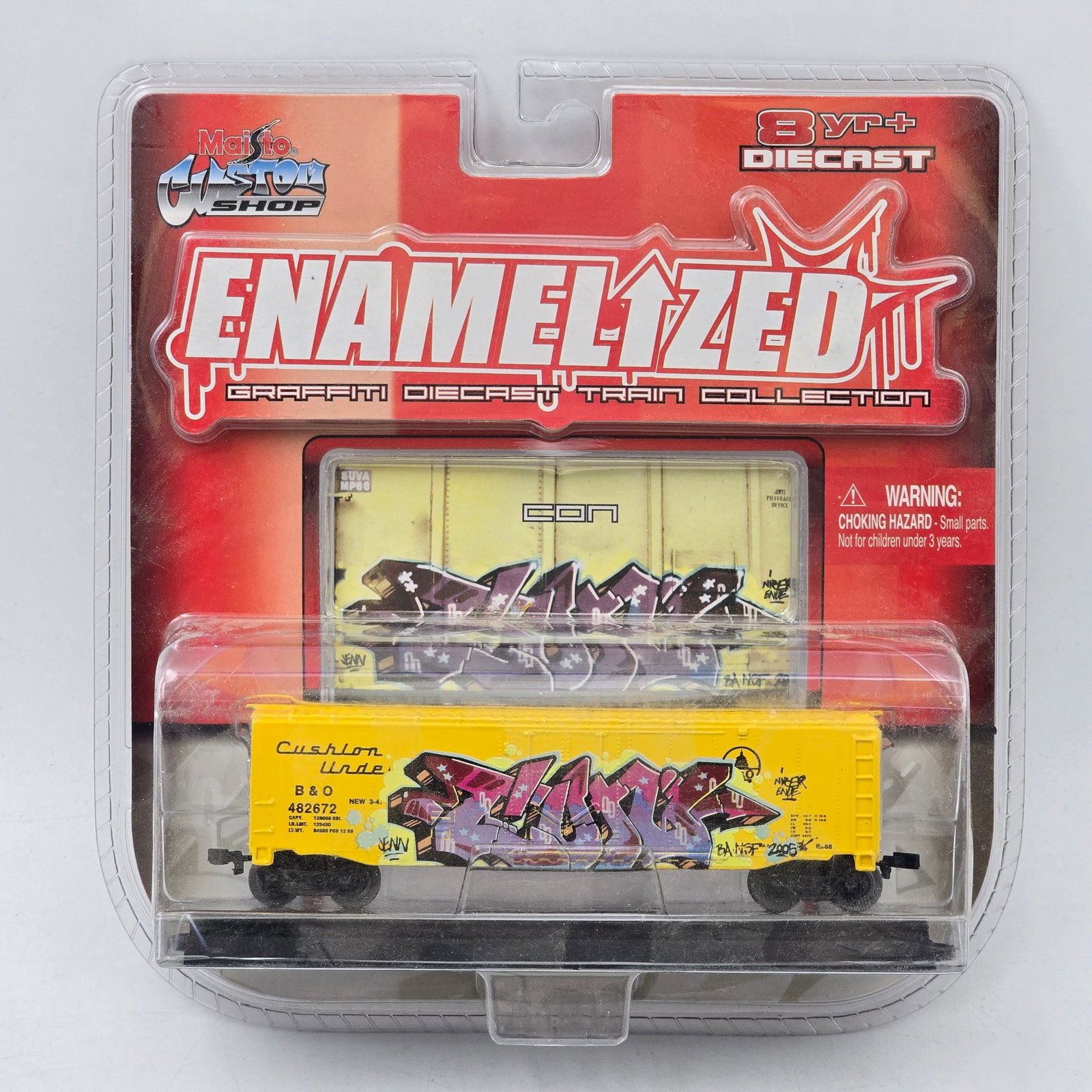 Maisto Enamelized Train Car: 1 Maisto Custom Enamelized graffiti diecast train car. Features a detailed boxcar with bold graffiti-style artwork, part of the Enamelized Graffiti Diecast Train Collection. Item is unopened in origin
