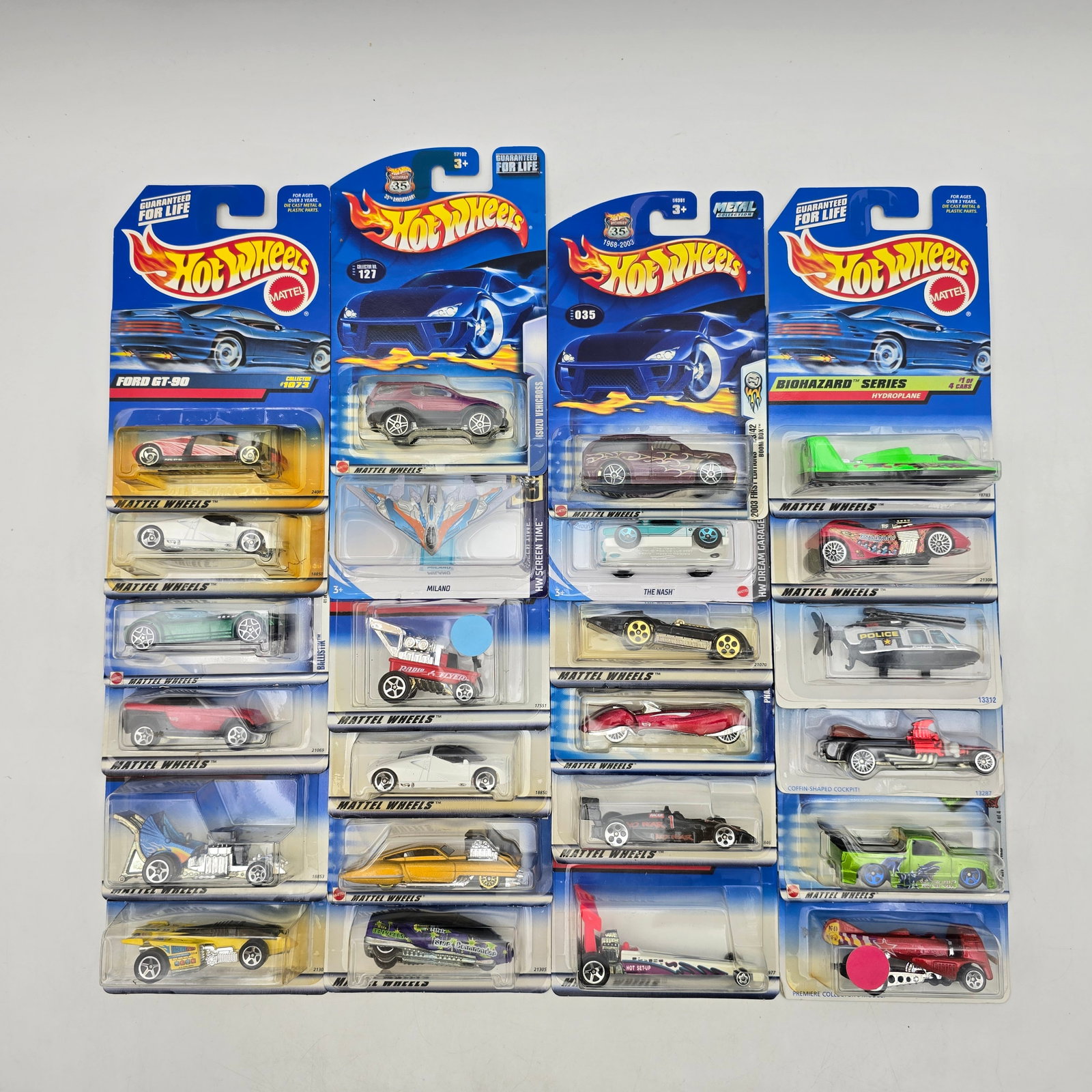 Hot Wheels Lot of 24 Carded Cars Mixed Series: Lot of 24 Hot Wheels diecast vehicles from a mix of mid-2000s to early 2010s releases, featuring a combination of mainline cars and themed series including Biohazard Series and multi-pack exclusives. 