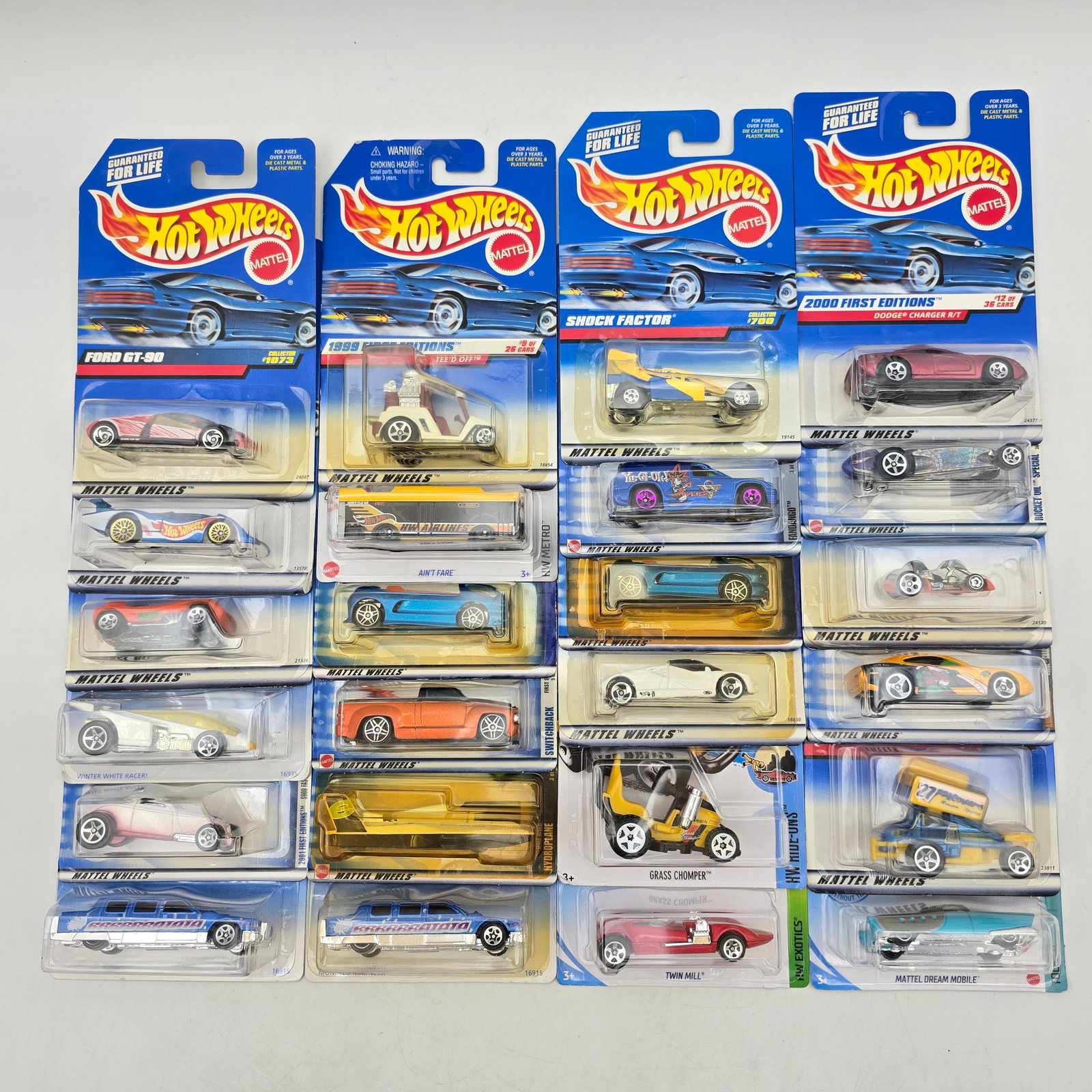 Lot of 24 Hot Wheels Diecast Models Mixed: Group of 24 Hot Wheels diecast vehicles spanning late 1990s to early 2000s releases, including First Editions, 1999â€“2000 series cars, and a variety of fantasy, concept, and street models. No