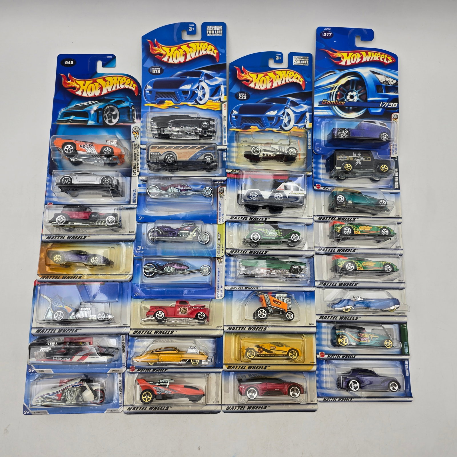 Hot Wheels 30 Car Lot Early 2000s Sealed: Lot of 30 Hot Wheels diecast cars from the early 2000s. Includes a mix of First Editions and mainline releases, featuring a variety of vehicle styles such as muscle cars, sports cars, and unique desig