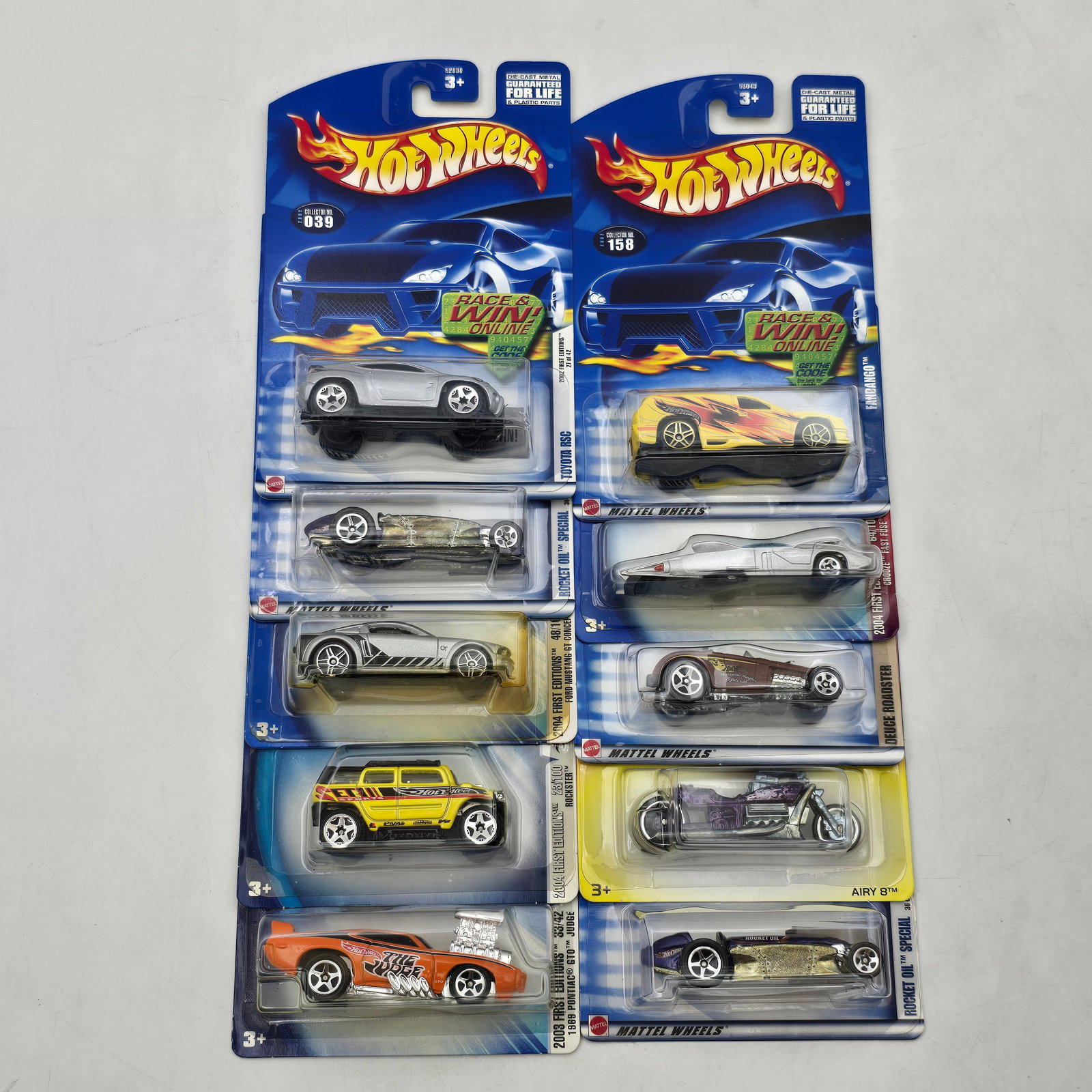 Hot Wheels Lot of 10 Carded Cars Mixed Series: Lot of 10 Hot Wheels diecast vehicles from a mix of early to mid-2000s releases, featuring a combination of mainline cars and multi-pack or promotional style editions. Includes a variety of castings s