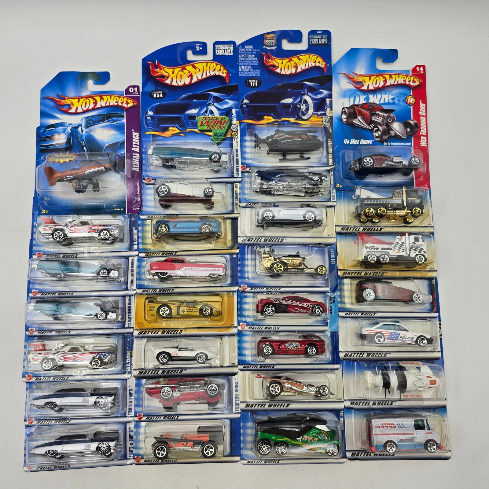 Hot Wheels Lot of 30 Carded Cars Mixed Series: Group of 30 Hot Wheels diecast vehicles dating to approximately the early to mid-2000s era, all in original unopened blister packaging. The lot features a strong mix of fantasy castings, custom builds