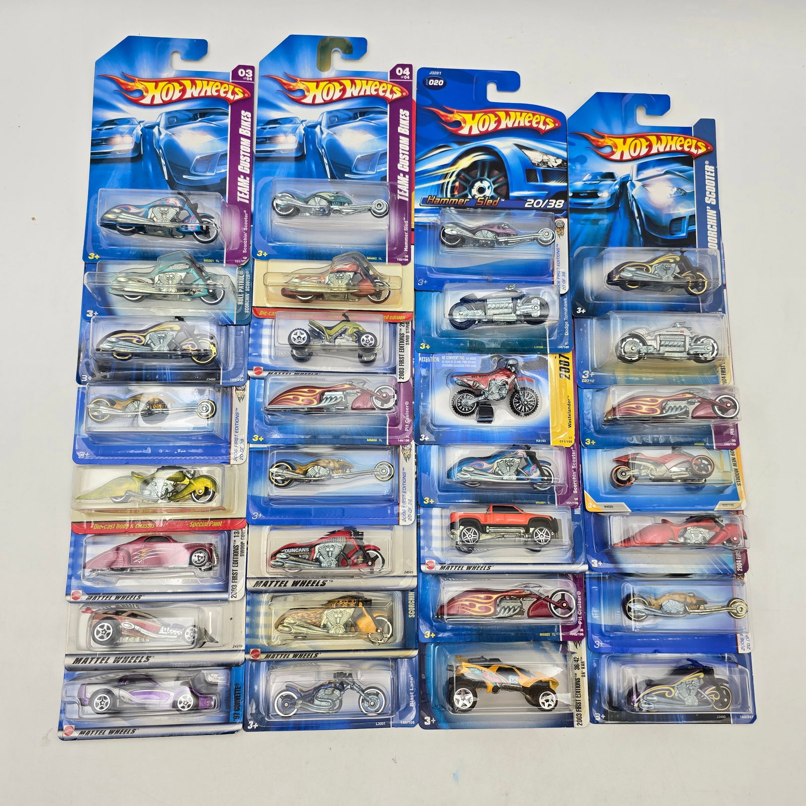 Lot Of 30 Hot Wheels Motorcycles & Vehicles: Lot of 30 Hot Wheels diecast vehicles, mostly motorcycle castings. Includes a variety of choppers, sport bikes, and stylized designs, with a few companion vehicles mixed in. All items are unopened in 