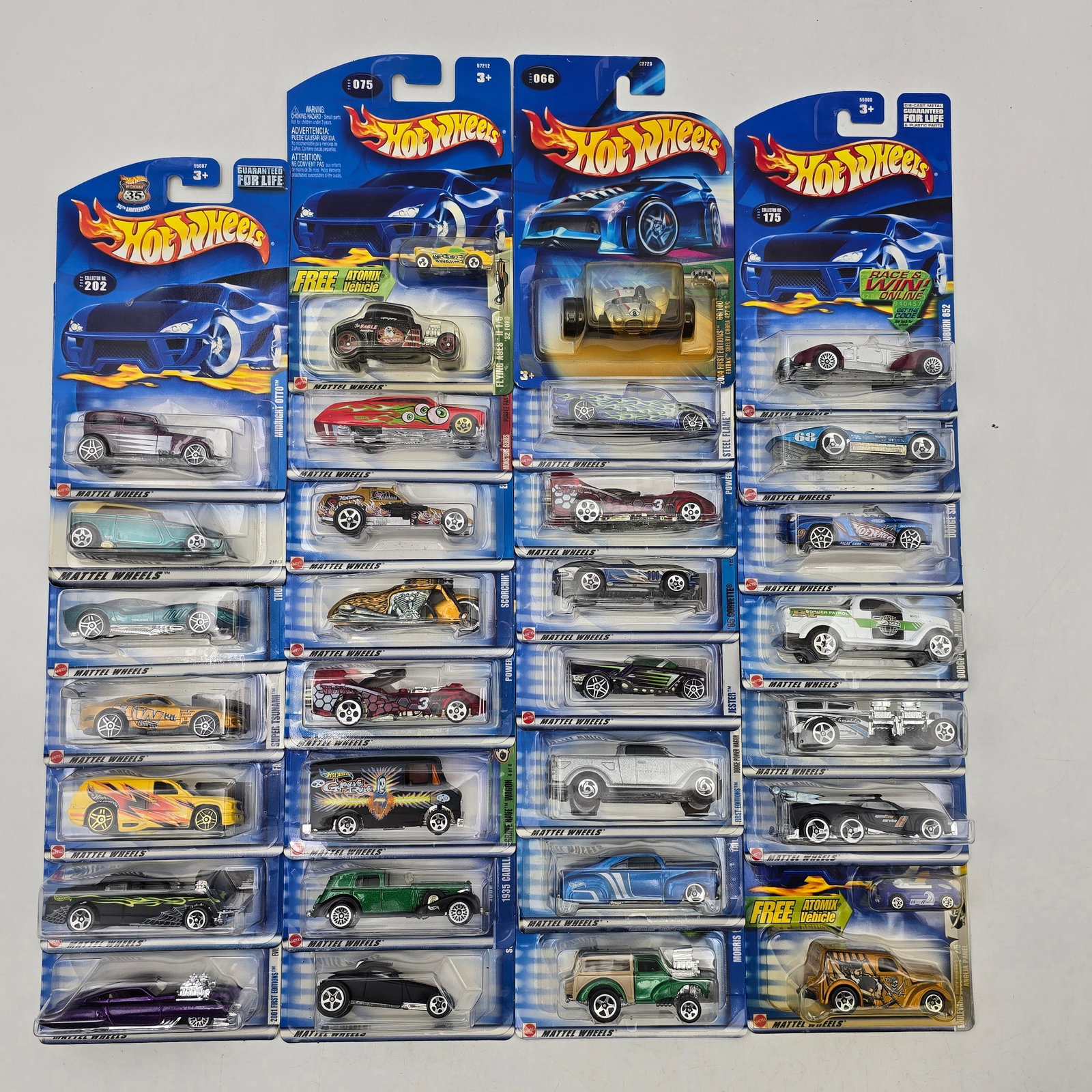 Lot Of 30 Hot Wheels Diecast Vehicles Mix: Group of 30 Hot Wheels diecast vehicles showcasing a broad range of castings. Includes muscle cars, hot rods, custom builds, and several stylized fantasy designs, with a few unique deco variations and