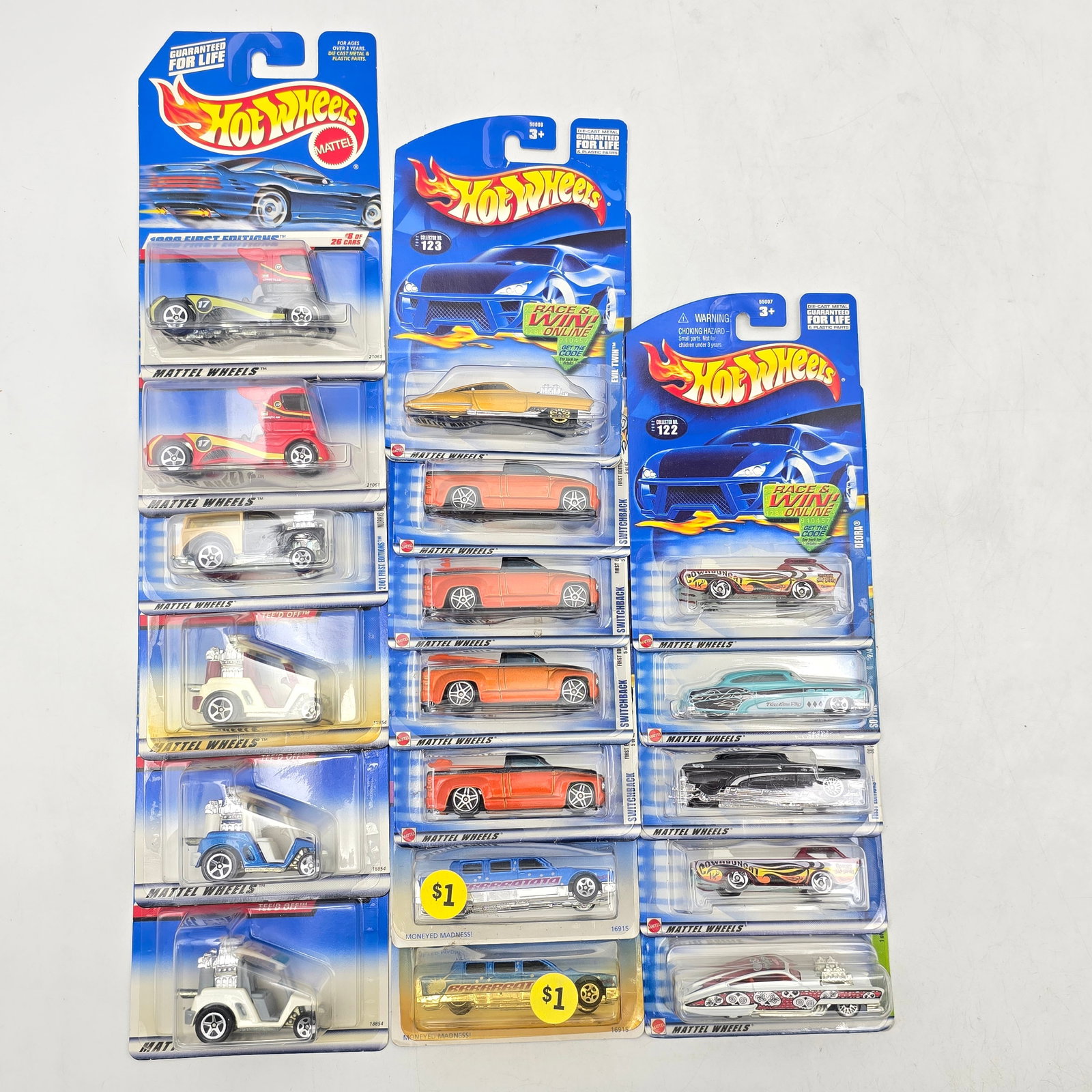 Lot Of 18 Hot Wheels Diecast Vehicles Mix: Lot of 18 Hot Wheels diecast vehicles featuring a mix of castings and styles. Includes several trucks and utility vehicles alongside cars and stylized designs, with a few matching or repeated castings