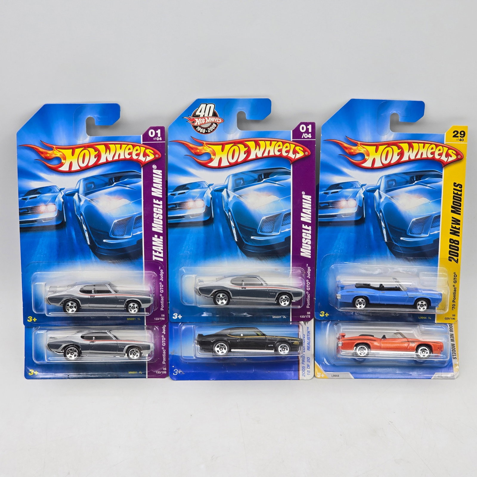Lot Of 6 Hot Wheels Pontiac Muscle Cars: Lot of 6 Hot Wheels diecast Pontiac castings. Includes multiple GTO-style models along with a convertible example, featuring a mix of classic colors and clean finishes. All items are unopened in origi